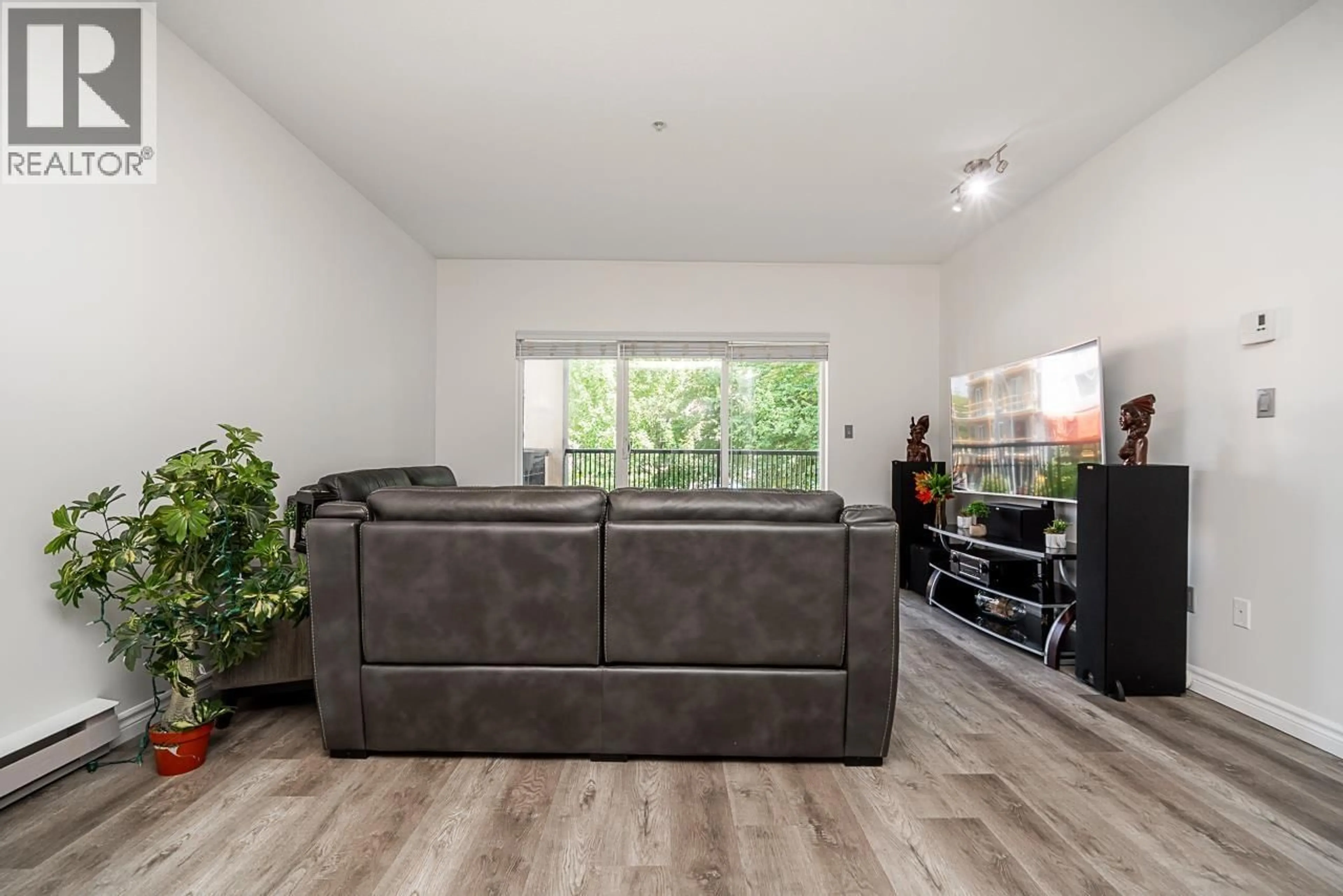 Living room with furniture, wood/laminate floor for 213 - 2478 WELCHER AVENUE, Port Coquitlam British Columbia V3C0A6