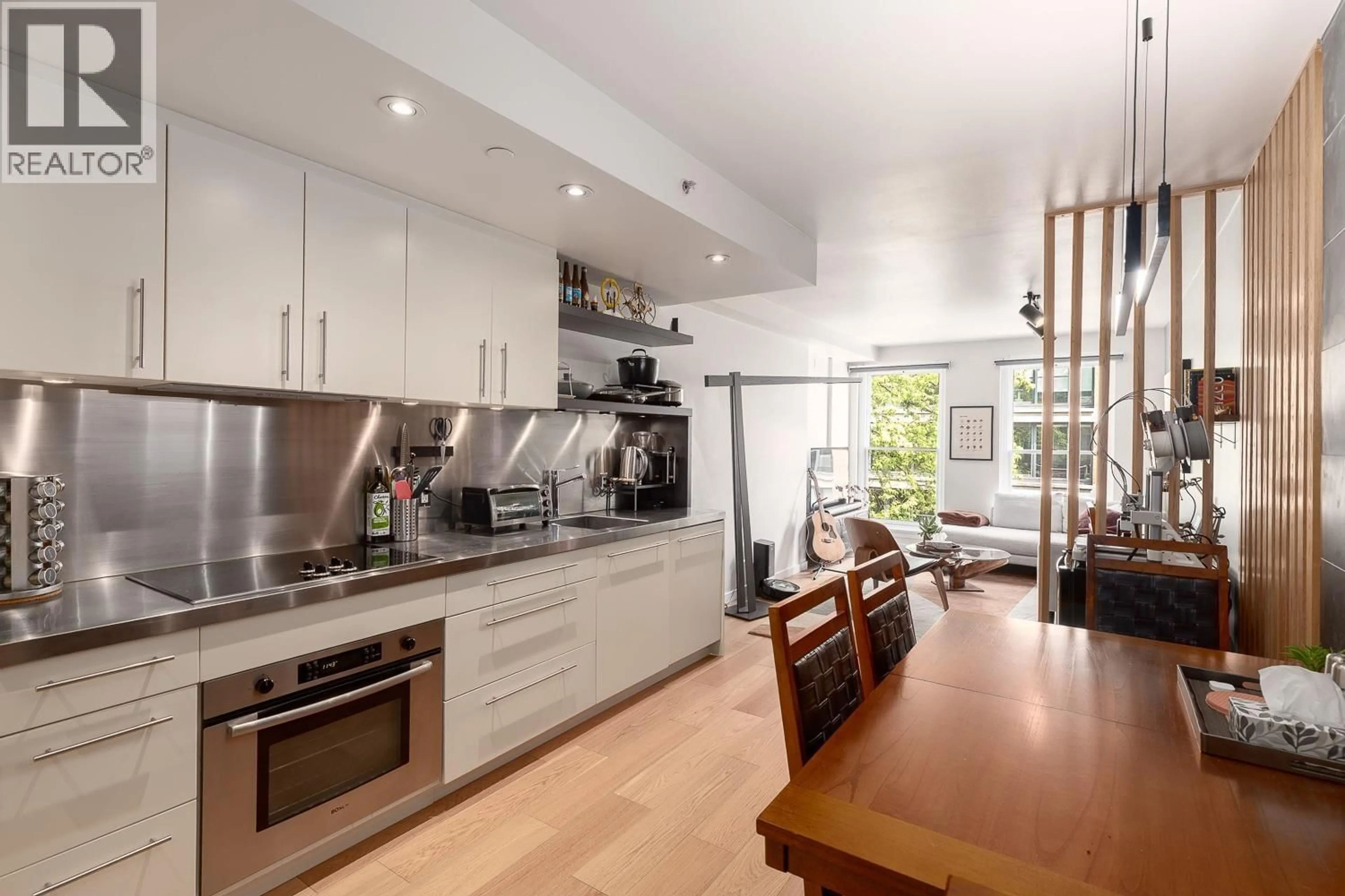 Contemporary kitchen, wood/laminate floor for 503 - 36 WATER STREET, Vancouver British Columbia V6B0B7