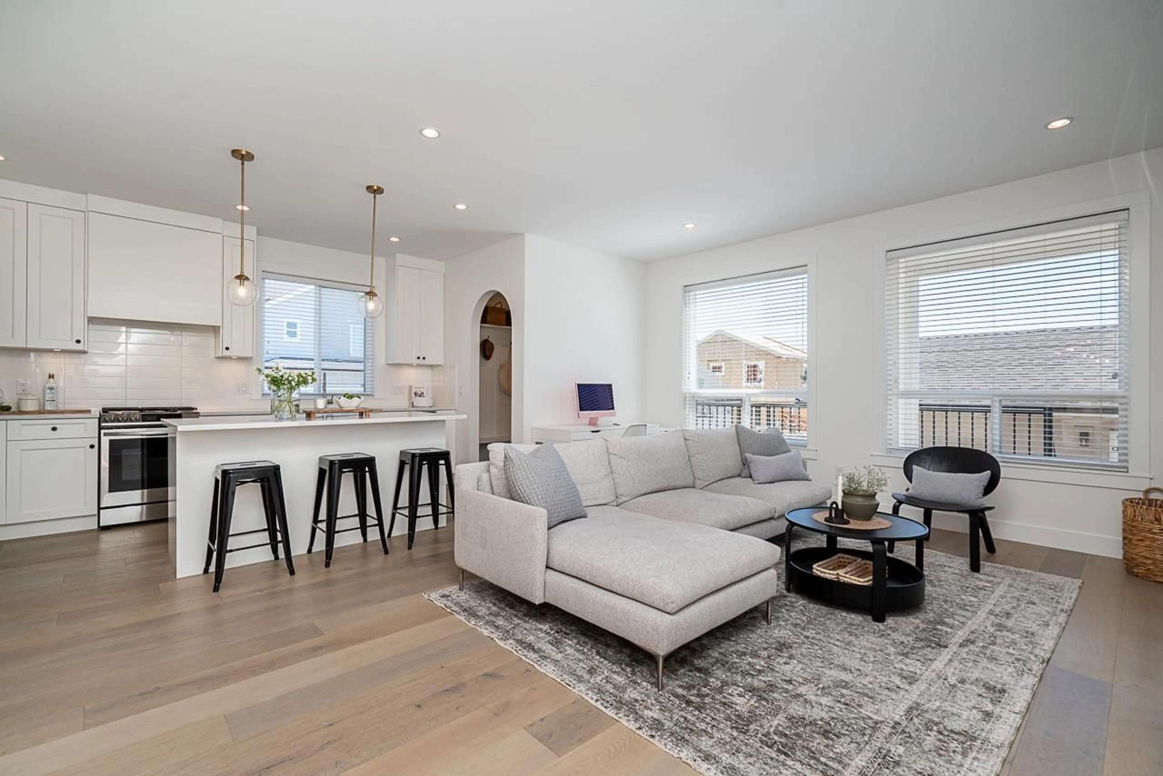 Living room with furniture, wood/laminate floor for 16792 21A, Surrey British Columbia V3Z0M3