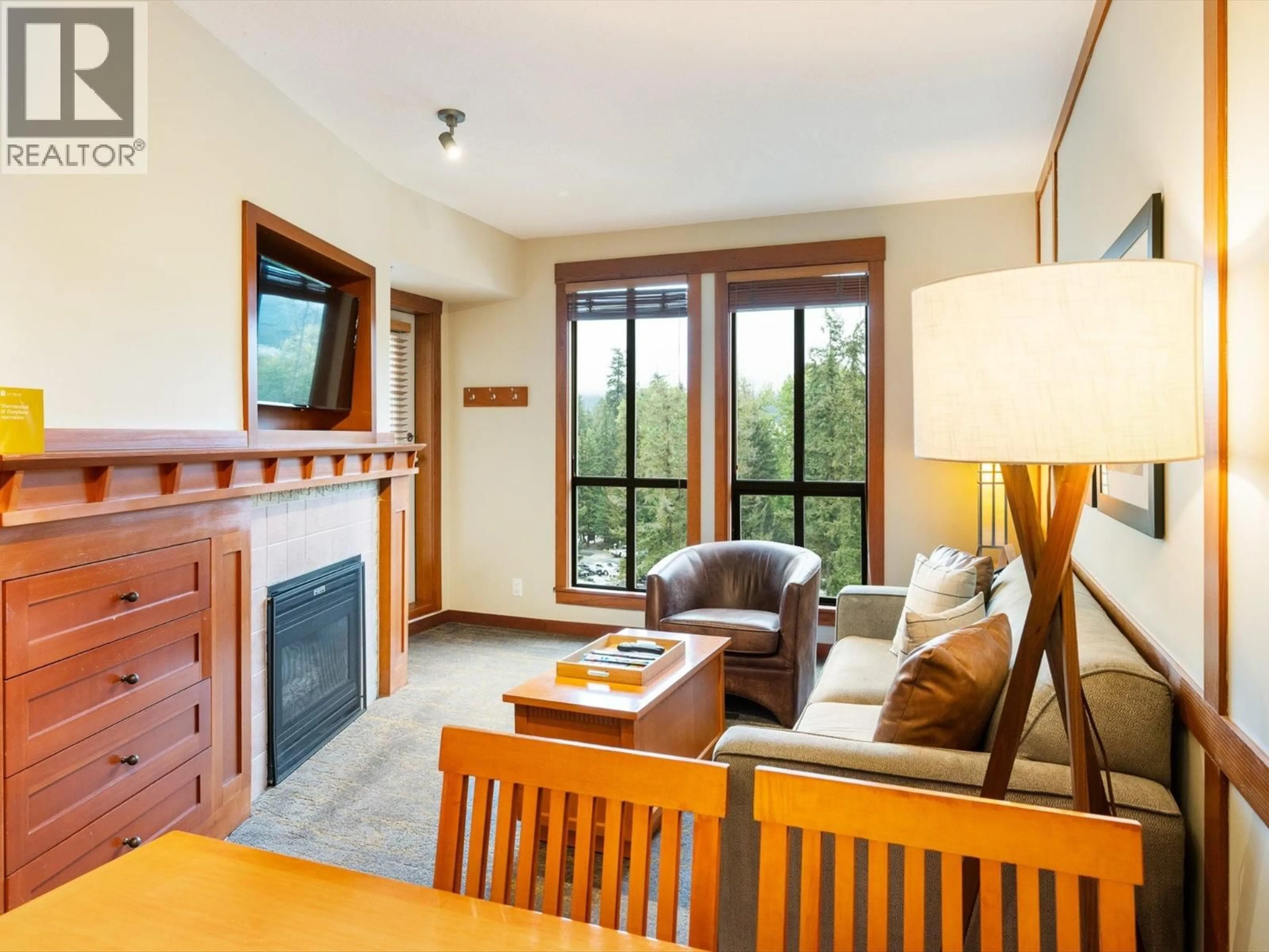 Living room with furniture, wood/laminate floor for 713 - 4320 SUNDIAL CRESCENT, Whistler British Columbia V8E1G6
