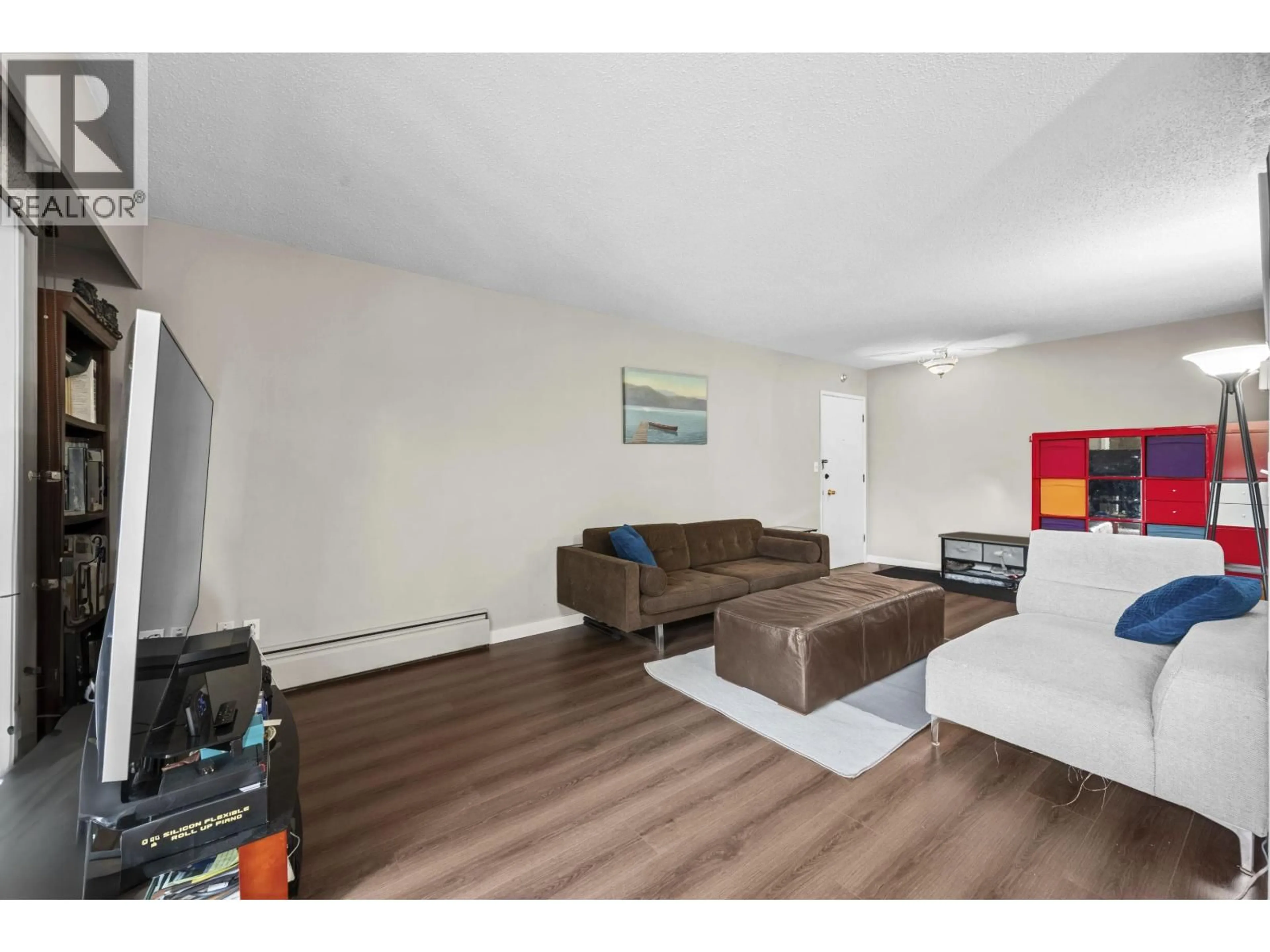 Living room with furniture, wood/laminate floor for 204 - 8020 RYAN ROAD, Richmond British Columbia V7A2E5