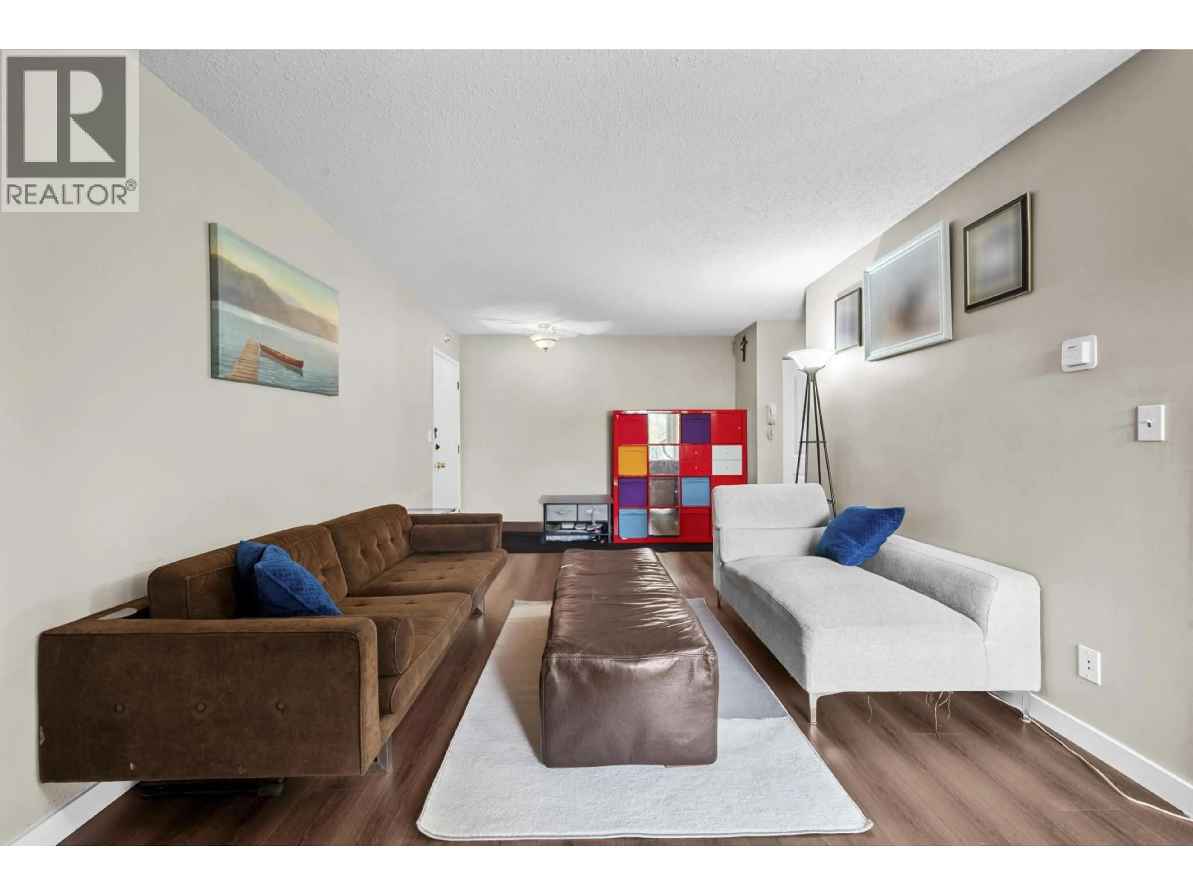 Living room with furniture, wood/laminate floor for 204 - 8020 RYAN ROAD, Richmond British Columbia V7A2E5