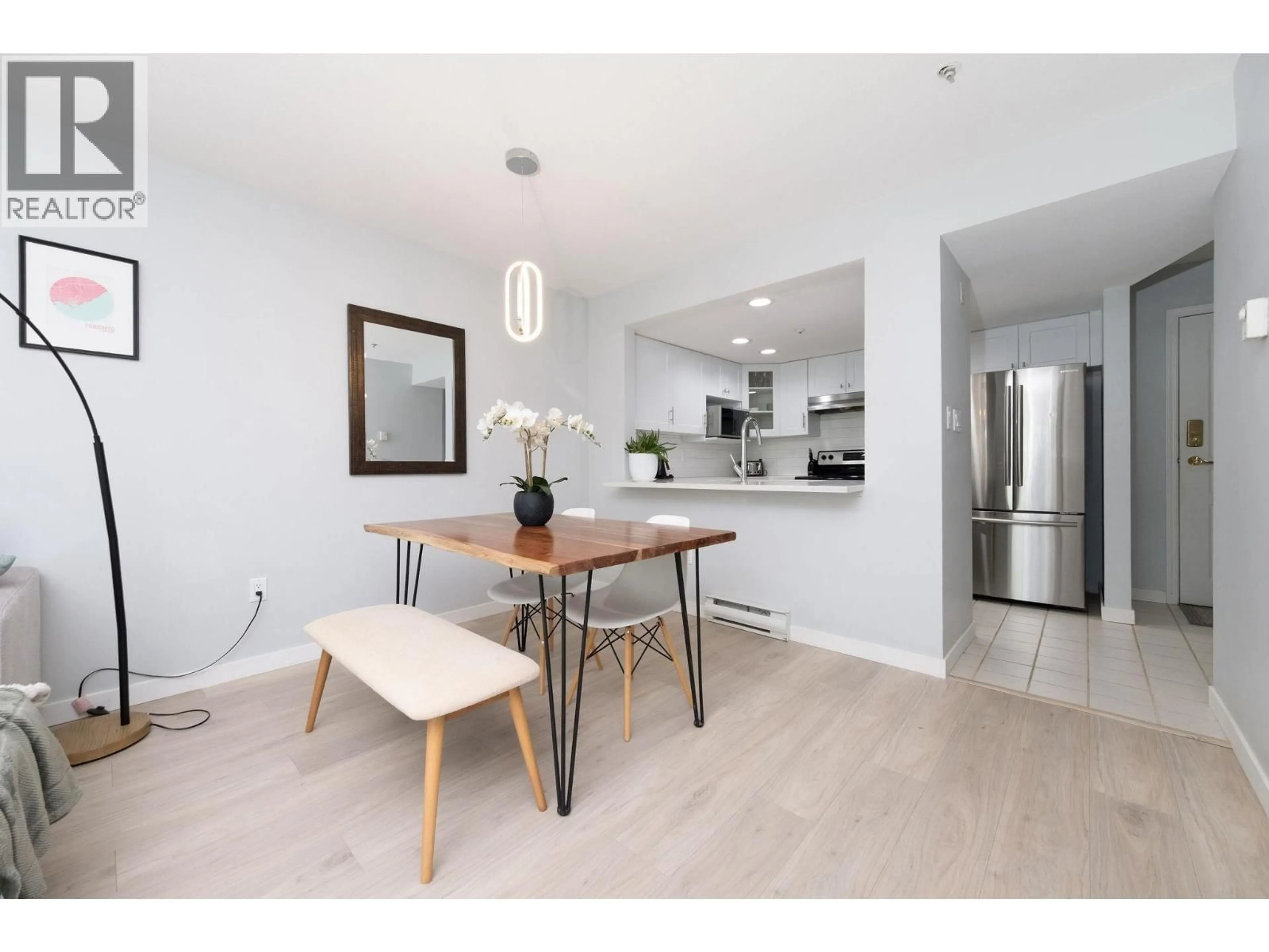 Open concept kitchen, wood/laminate floor for 305 - 789 16 AVENUE, Vancouver British Columbia V5Z1S8