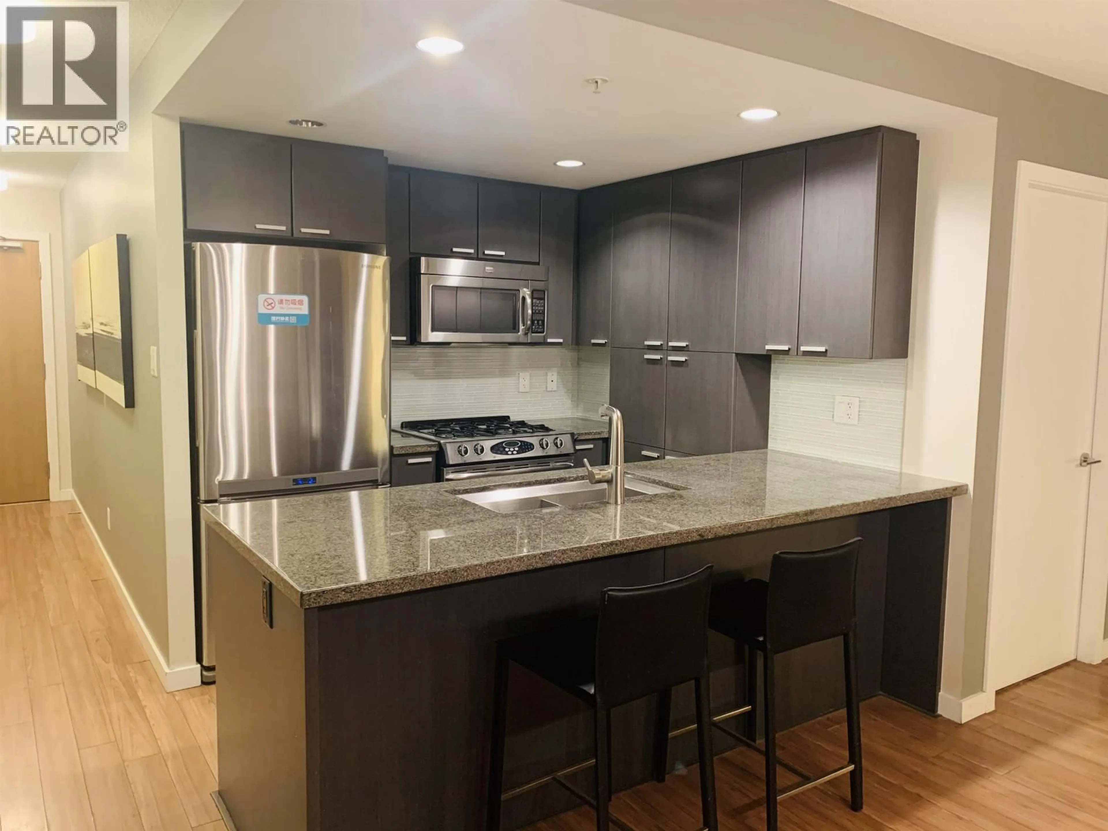Open concept kitchen, wood/laminate floor for 1406 - 2200 DOUGLAS ROAD, Burnaby British Columbia V5C0G8