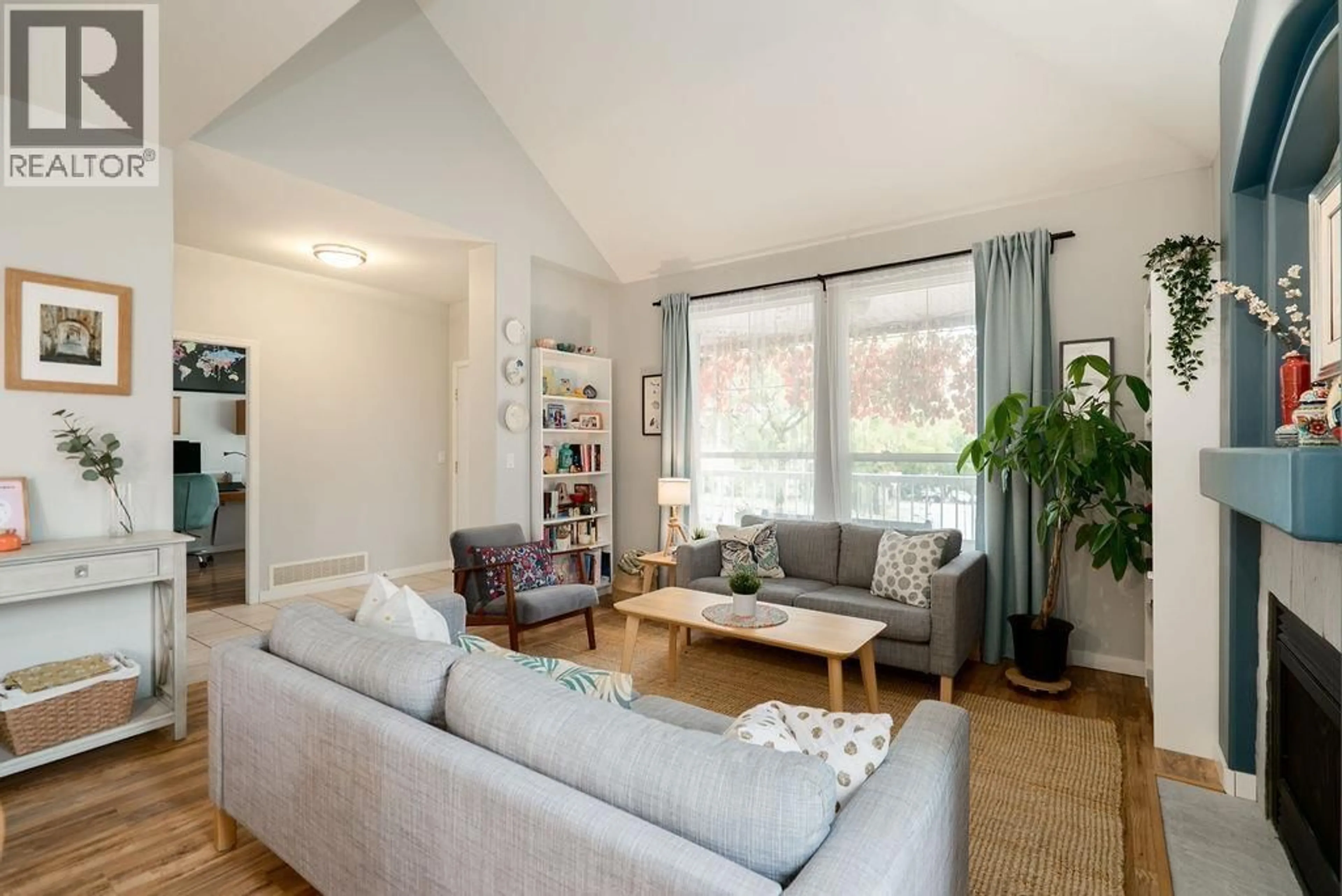 Living room with furniture, wood/laminate floor for 23801 KANAKA WAY, Maple Ridge British Columbia V2W1E5