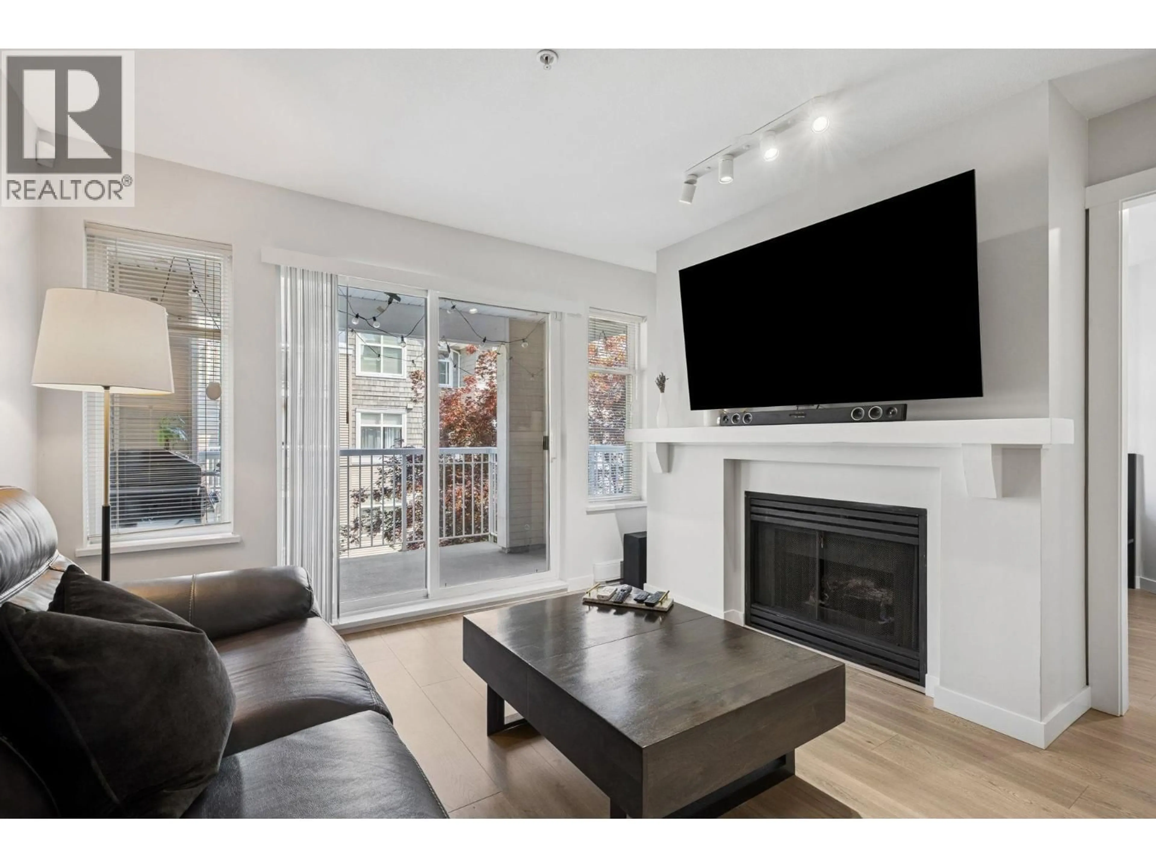 Living room with furniture, unknown for 310 - 1438 PARKWAY BOULEVARD, Coquitlam British Columbia V3E3M1