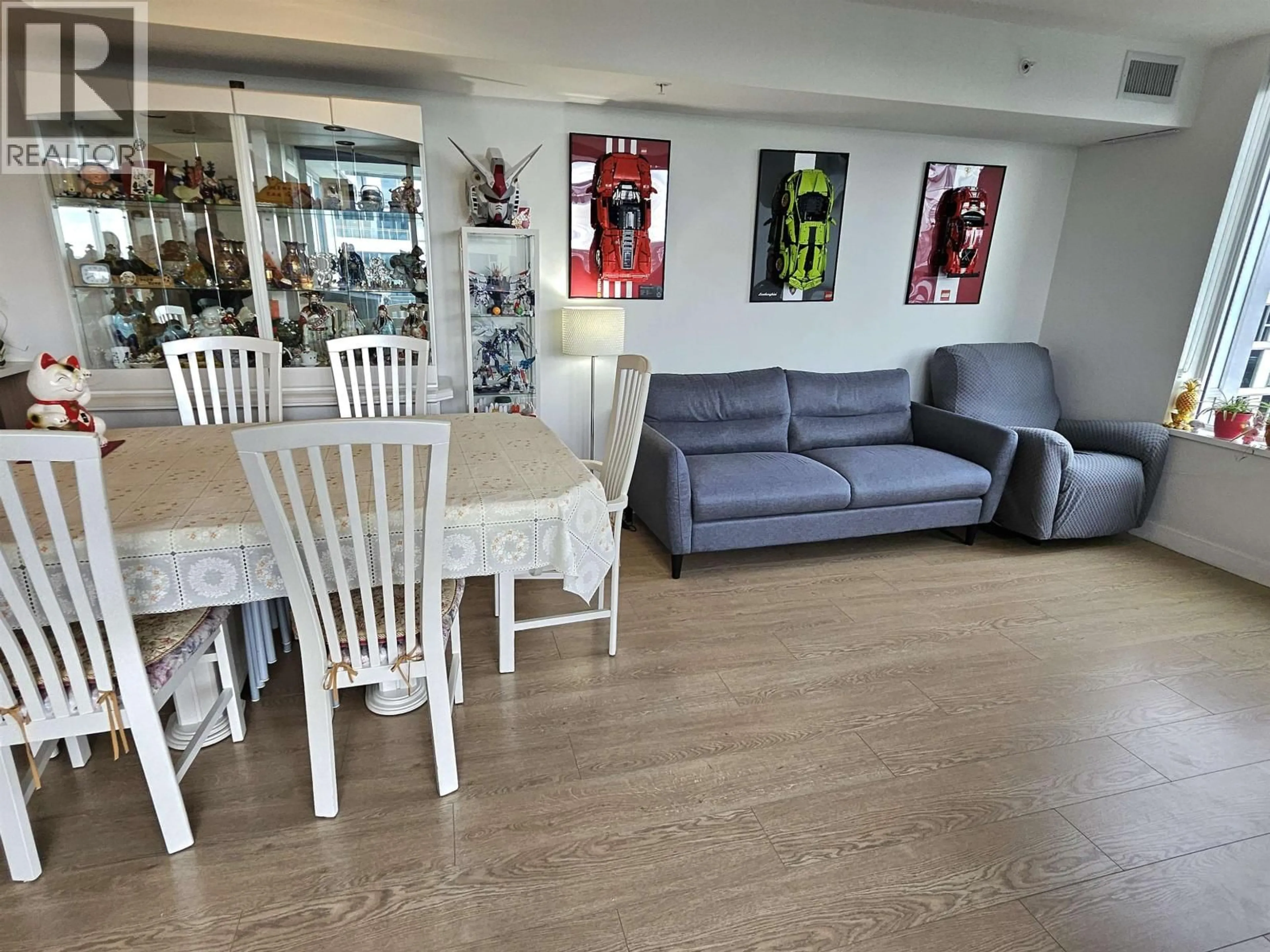 Living room with furniture, wood/laminate floor for 1705 - 3233 KETCHESON ROAD, Richmond British Columbia V6X0R3