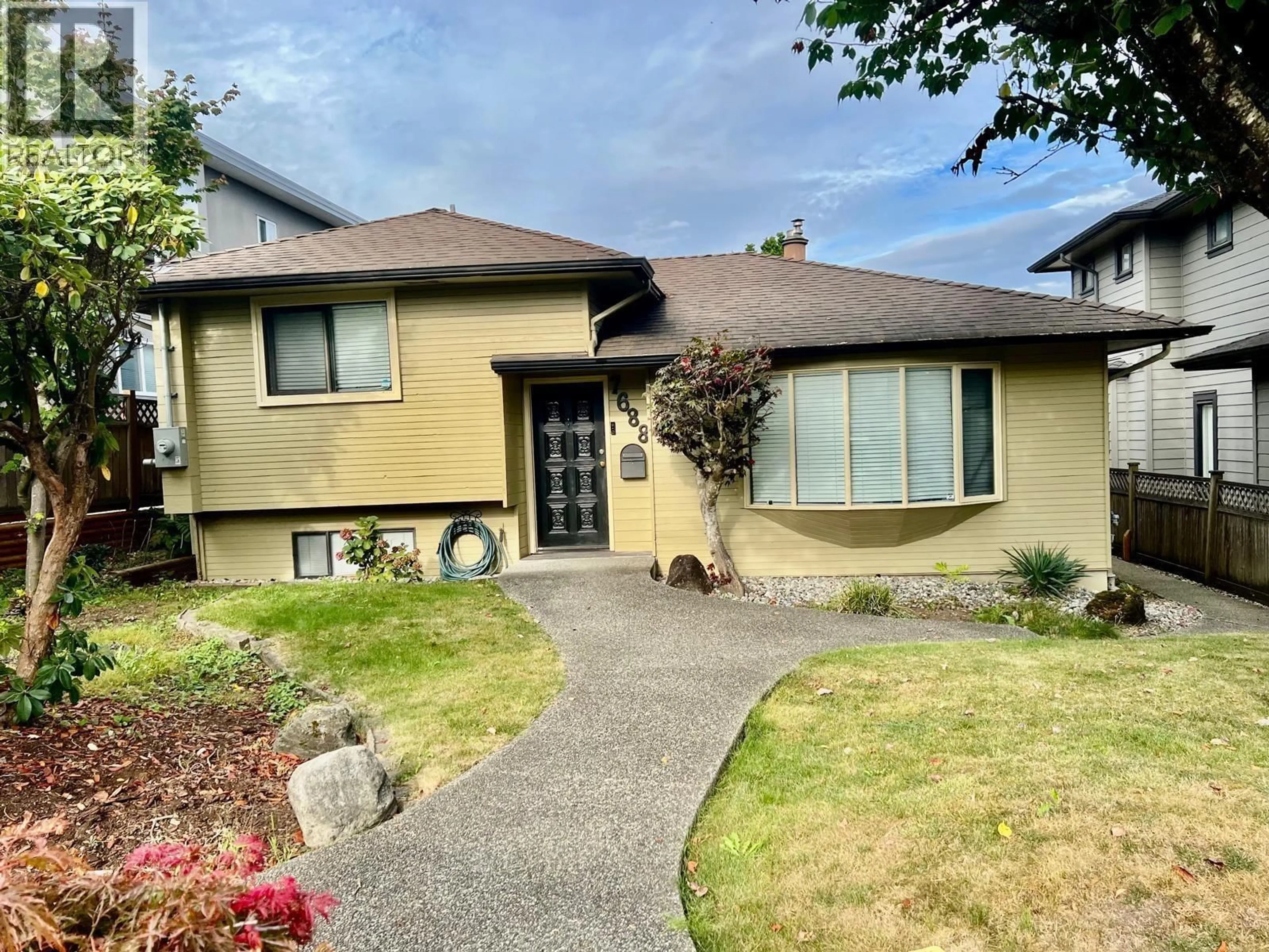 Home with vinyl exterior material, street for 7688 BURGESS STREET, Burnaby British Columbia V3N3J2