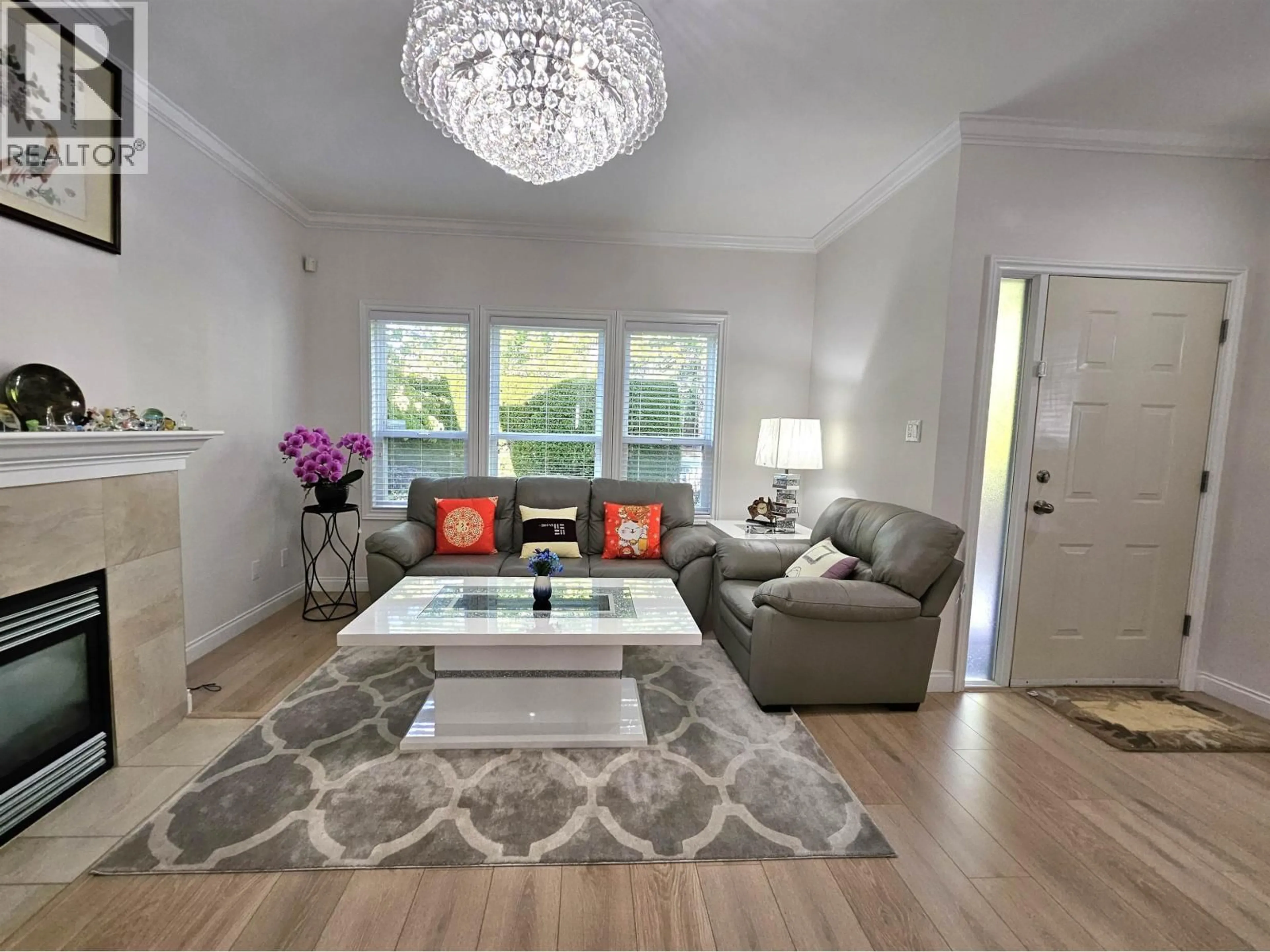 Living room with furniture, wood/laminate floor for 1 - 6733 LIVINGSTONE PLACE, Richmond British Columbia V7C5V8