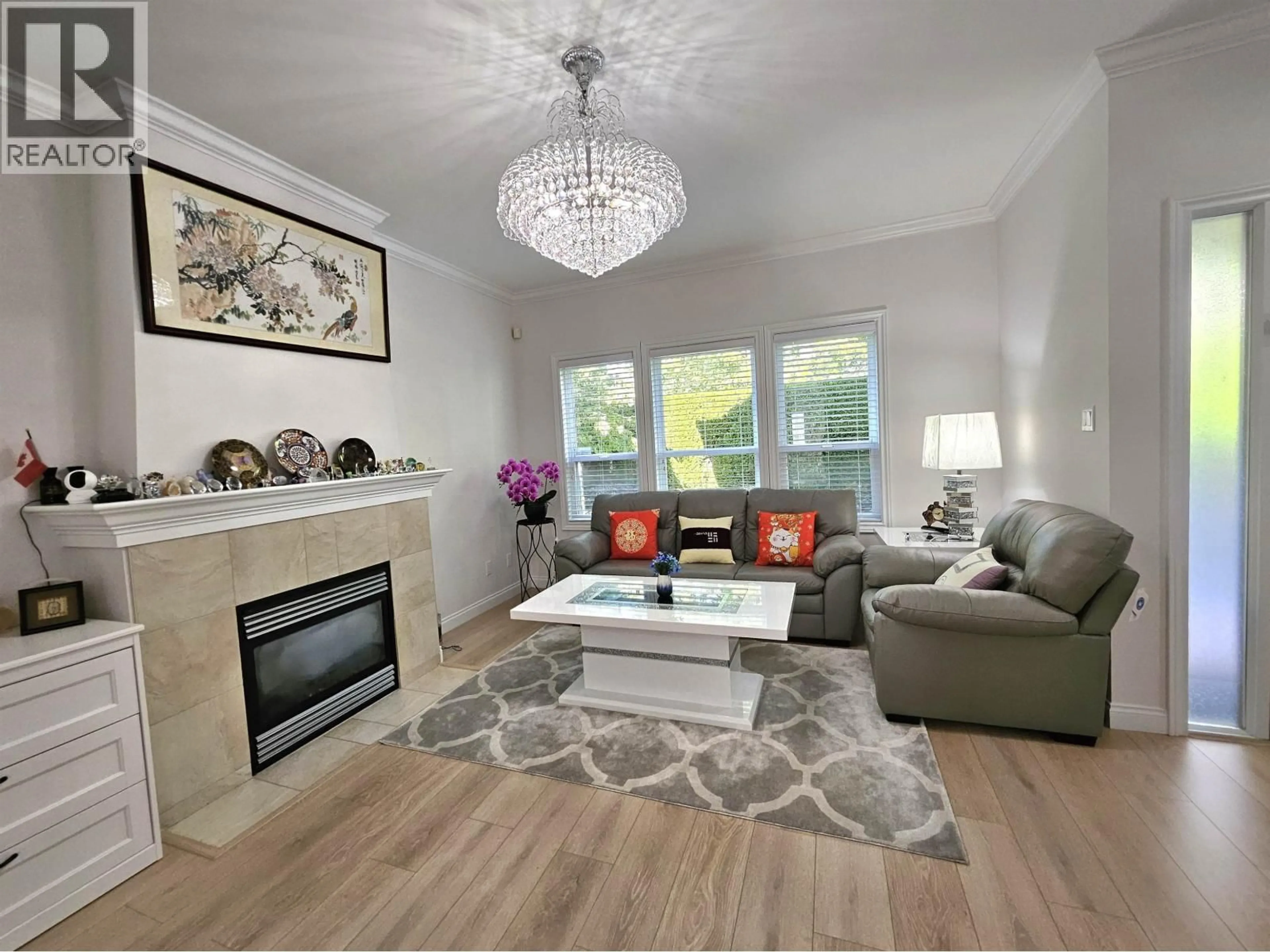 Living room with furniture, wood/laminate floor for 1 - 6733 LIVINGSTONE PLACE, Richmond British Columbia V7C5V8