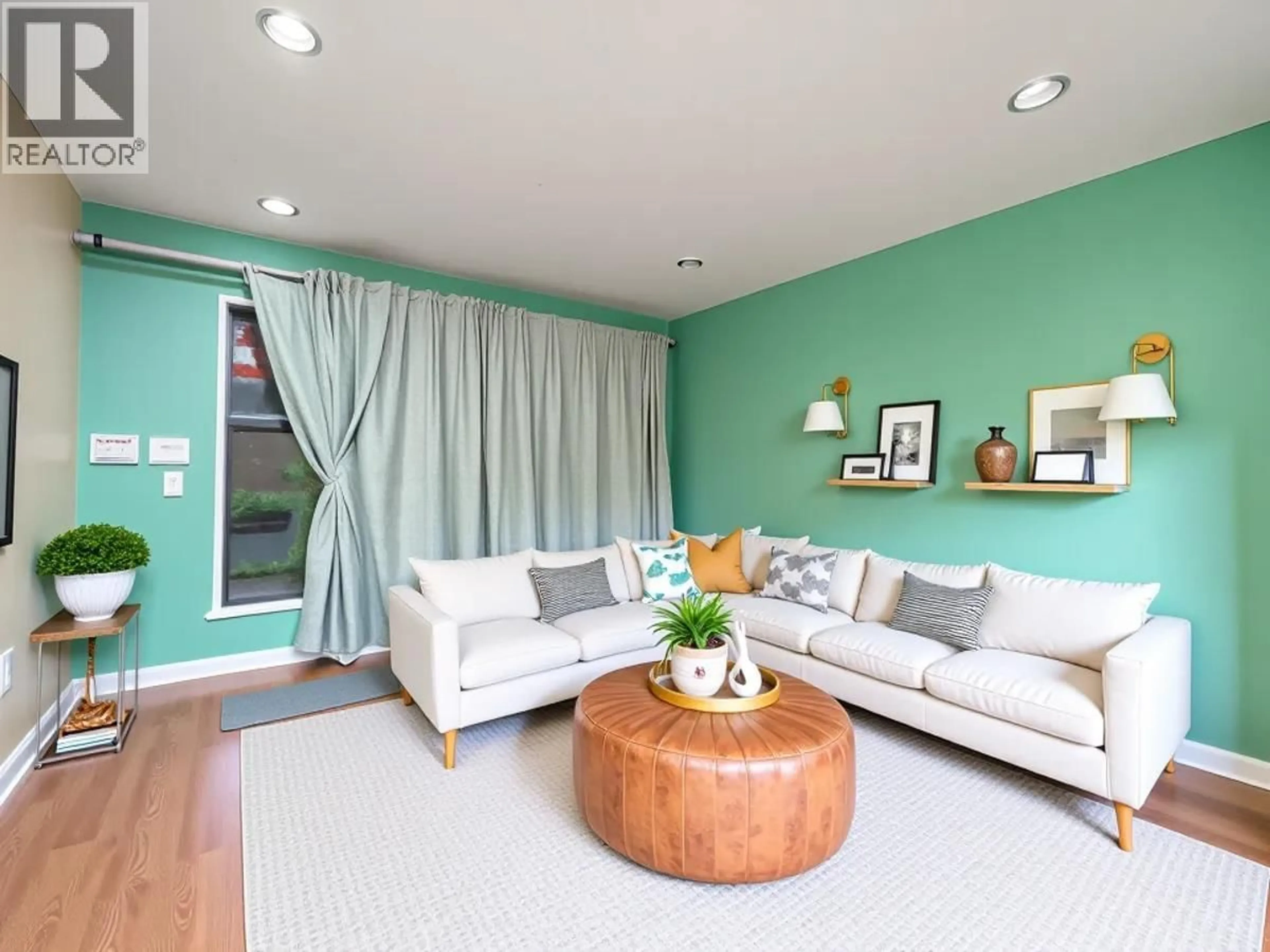 Living room with furniture, wood/laminate floor for 103 - 212 FORBES AVENUE, North Vancouver British Columbia V7M3E5