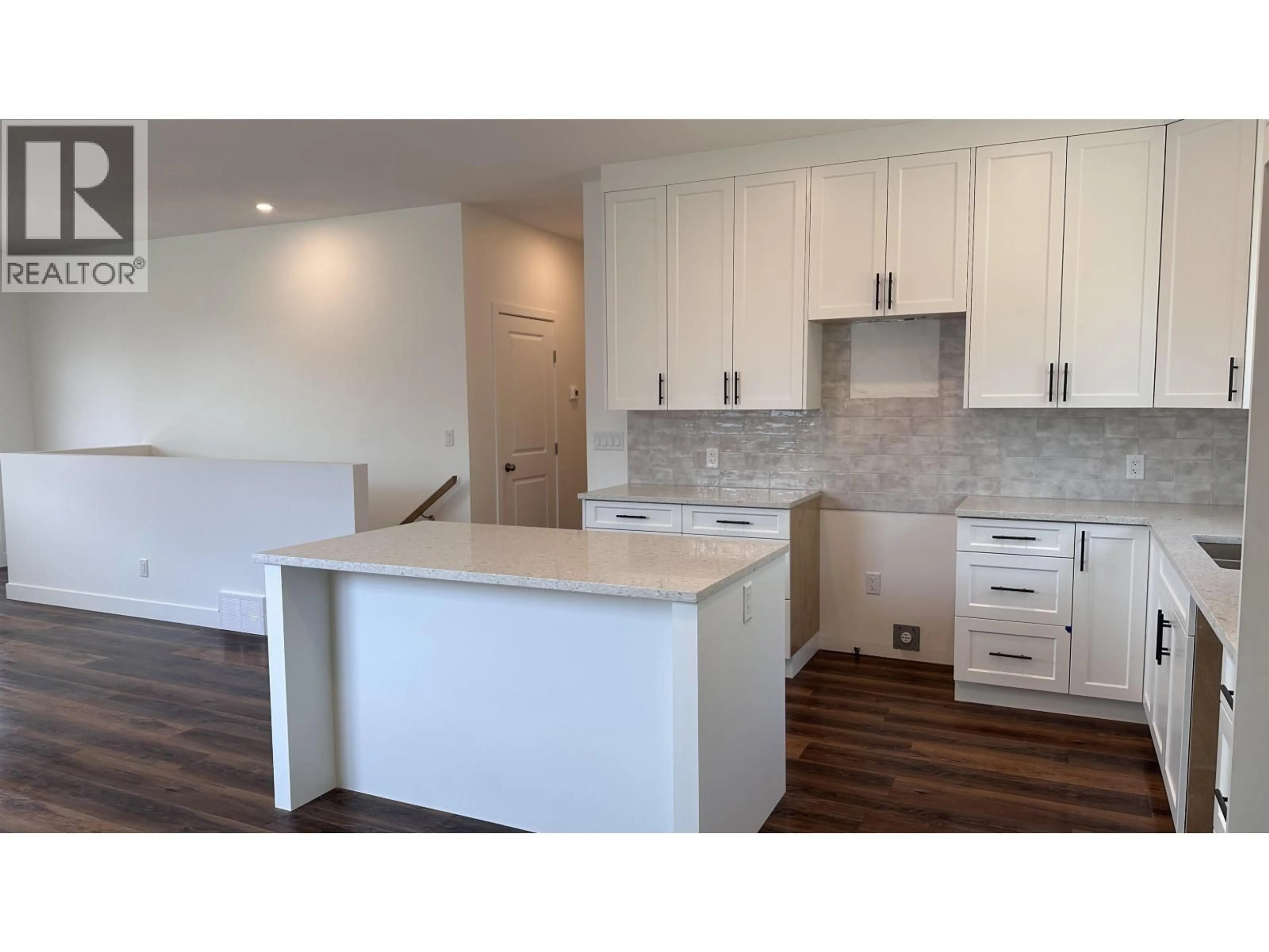 Open concept kitchen, wood/laminate floor for 7136 HILLU ROAD, Prince George British Columbia V2K0B4