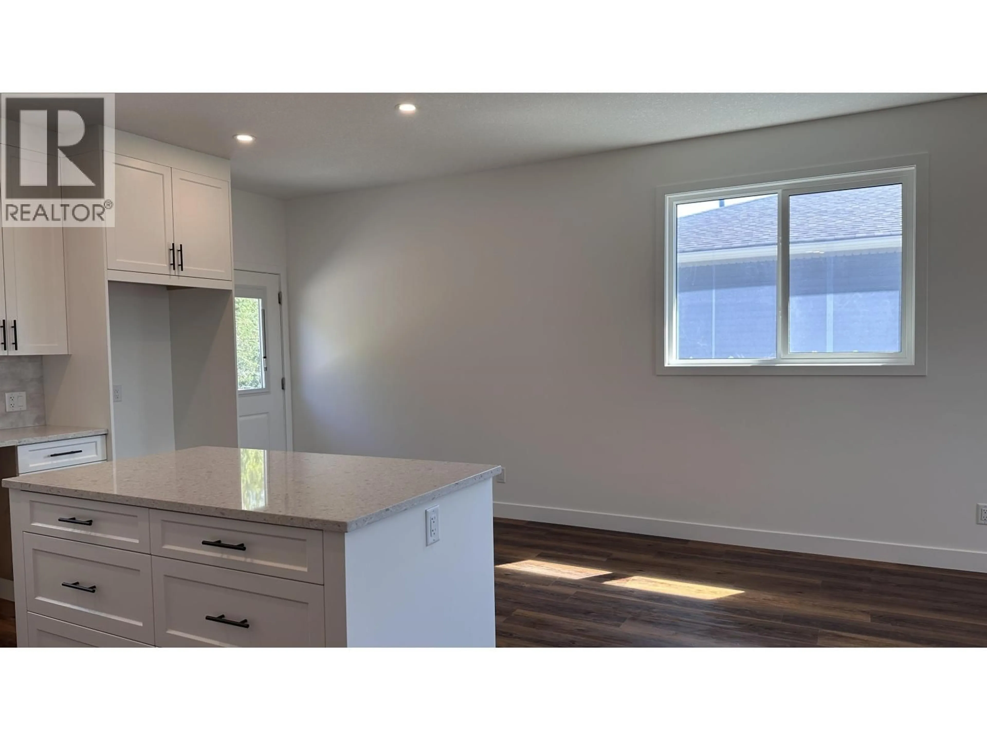 Open concept kitchen, wood/laminate floor for 7136 HILLU ROAD, Prince George British Columbia V2K0B4