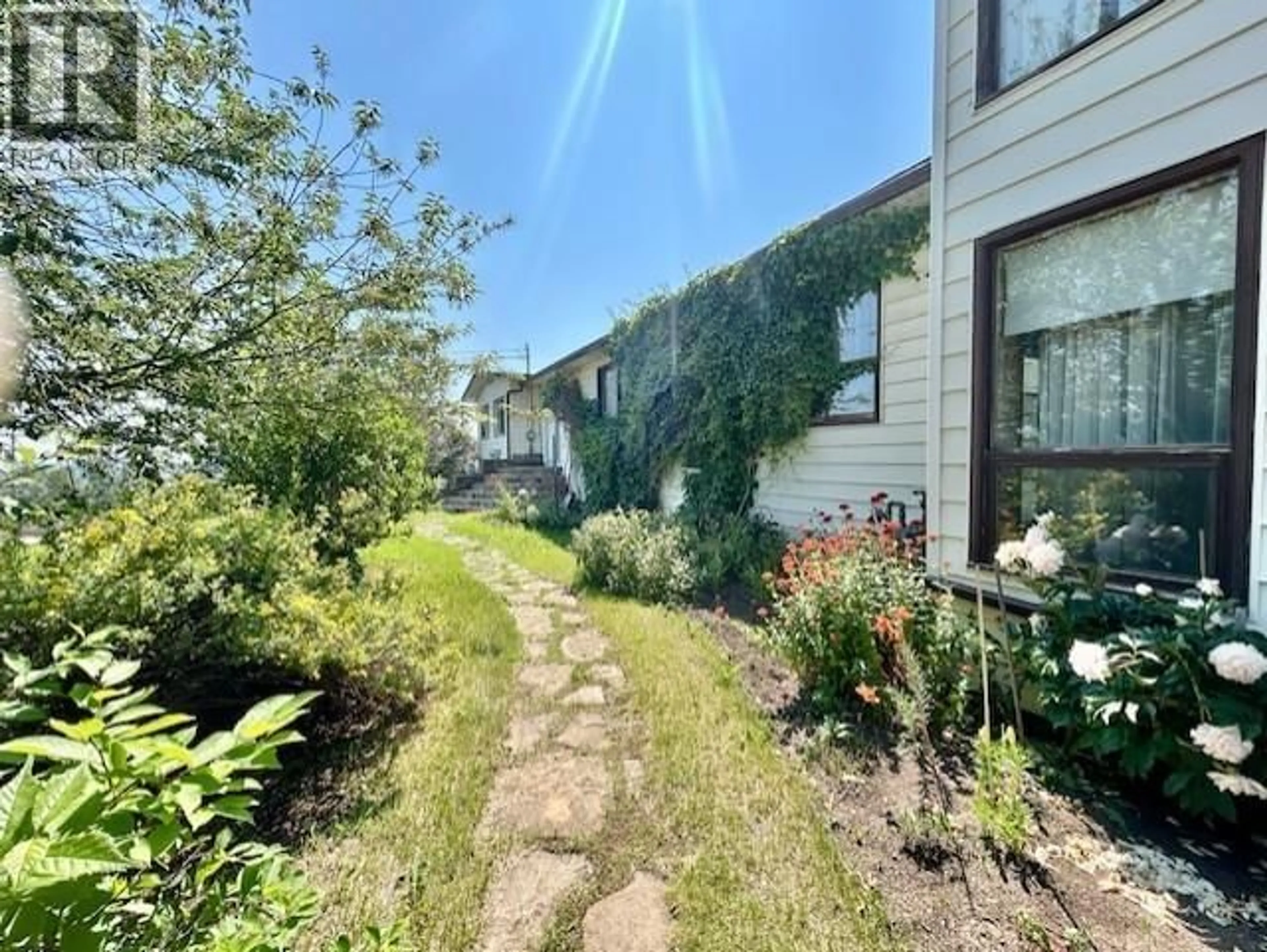 A pic from outside/outdoor area/front of a property/back of a property/a pic from drone, street for 5403 LIARD STREET, Fort Nelson British Columbia V0C1R0