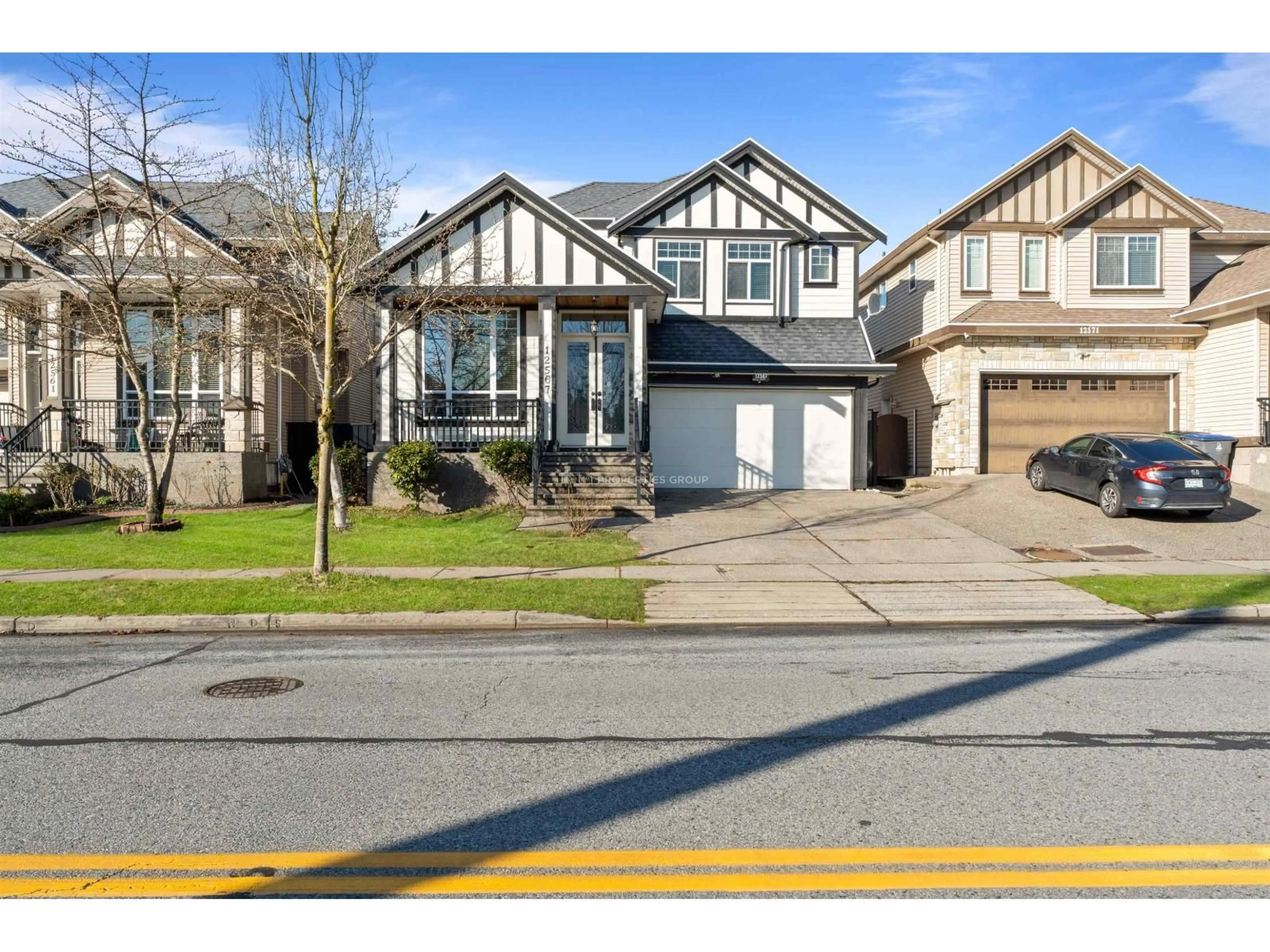 Home with vinyl exterior material, street for 12567 66 AVE, Surrey British Columbia V3W1V6