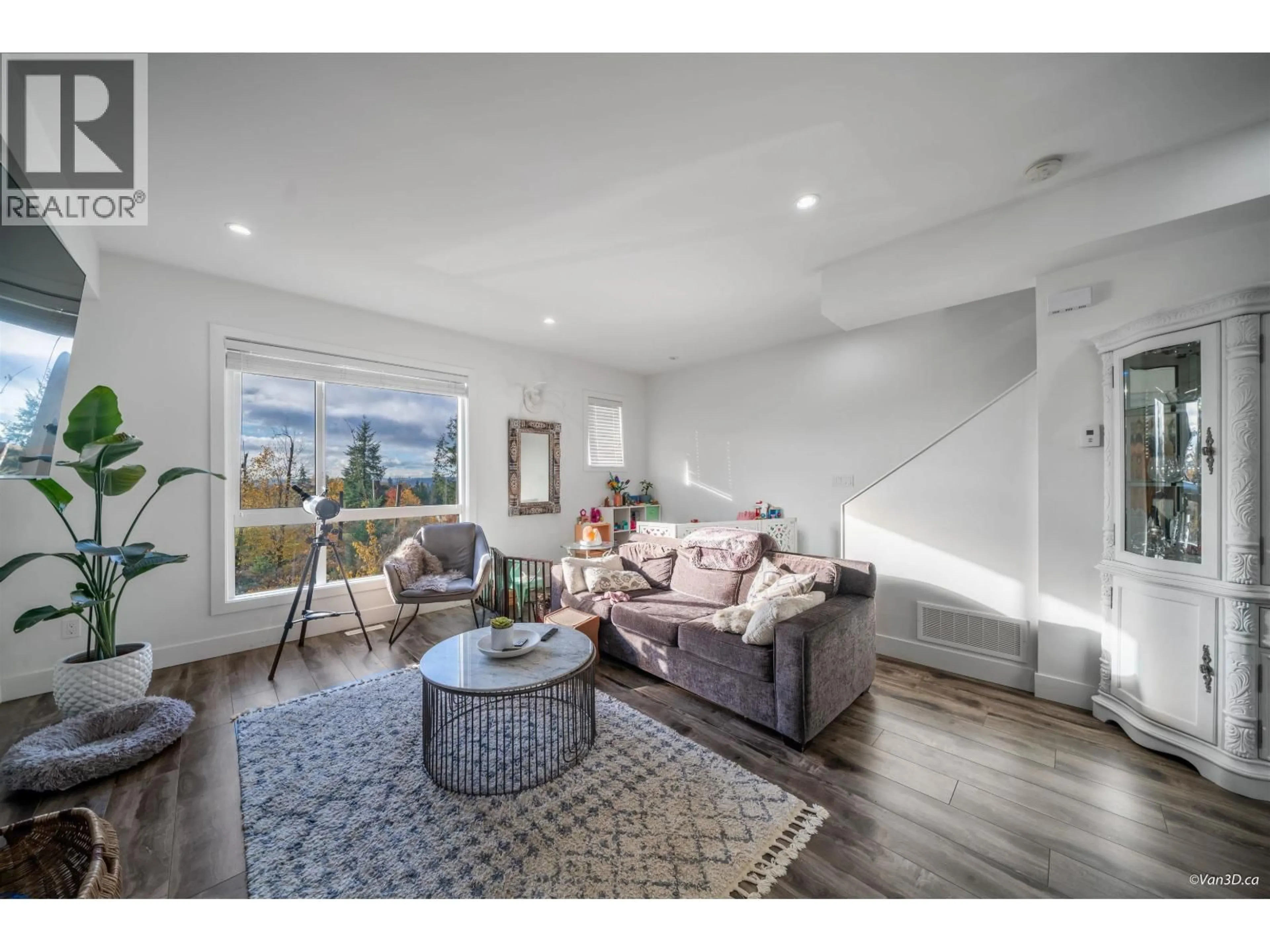 Living room with furniture, wood/laminate floor for 102 - 3423 ROXTON AVENUE, Coquitlam British Columbia V3B0G7