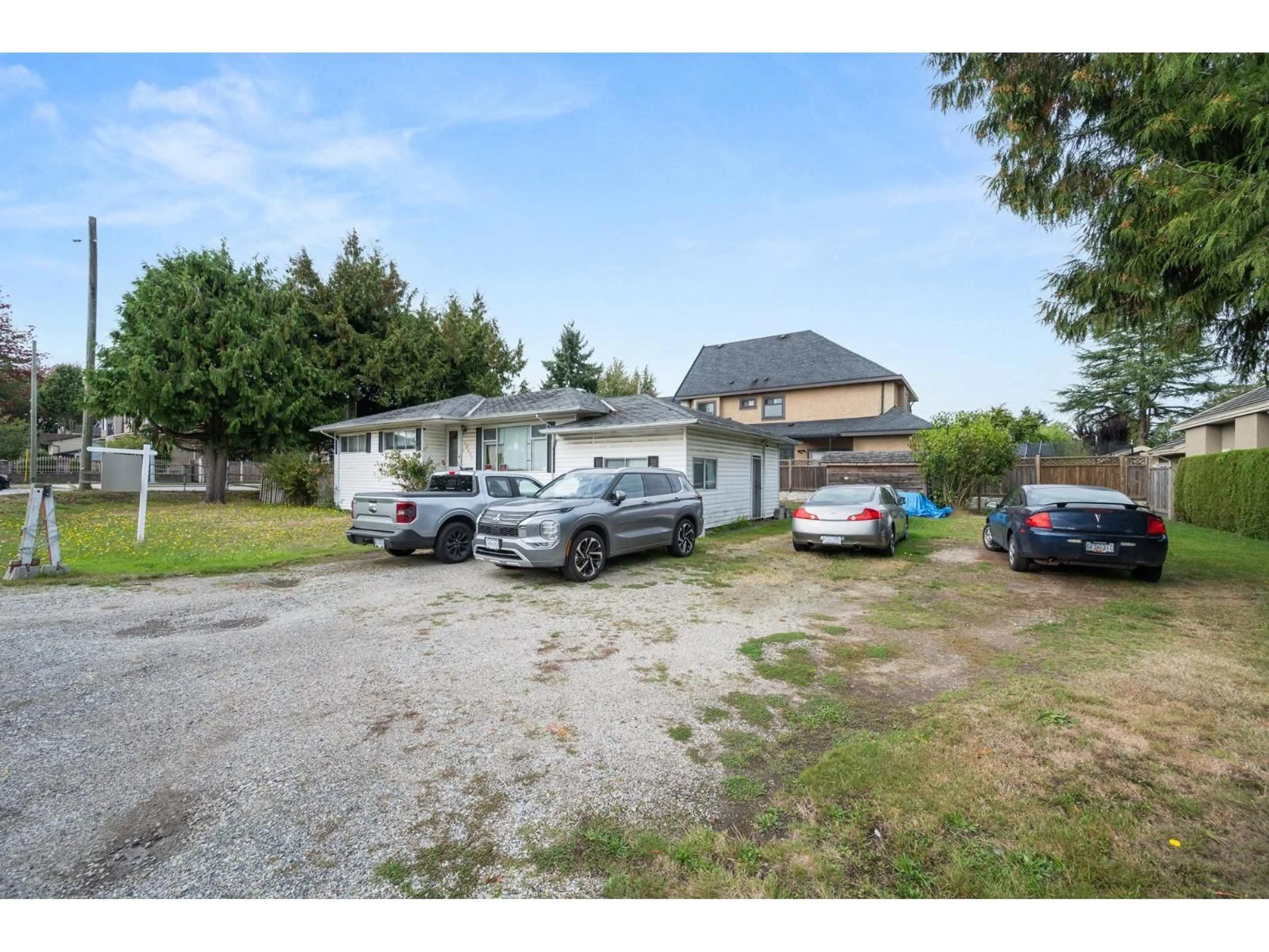 A pic from outside/outdoor area/front of a property/back of a property/a pic from drone, street for 12411 78, Surrey British Columbia V3W2X5