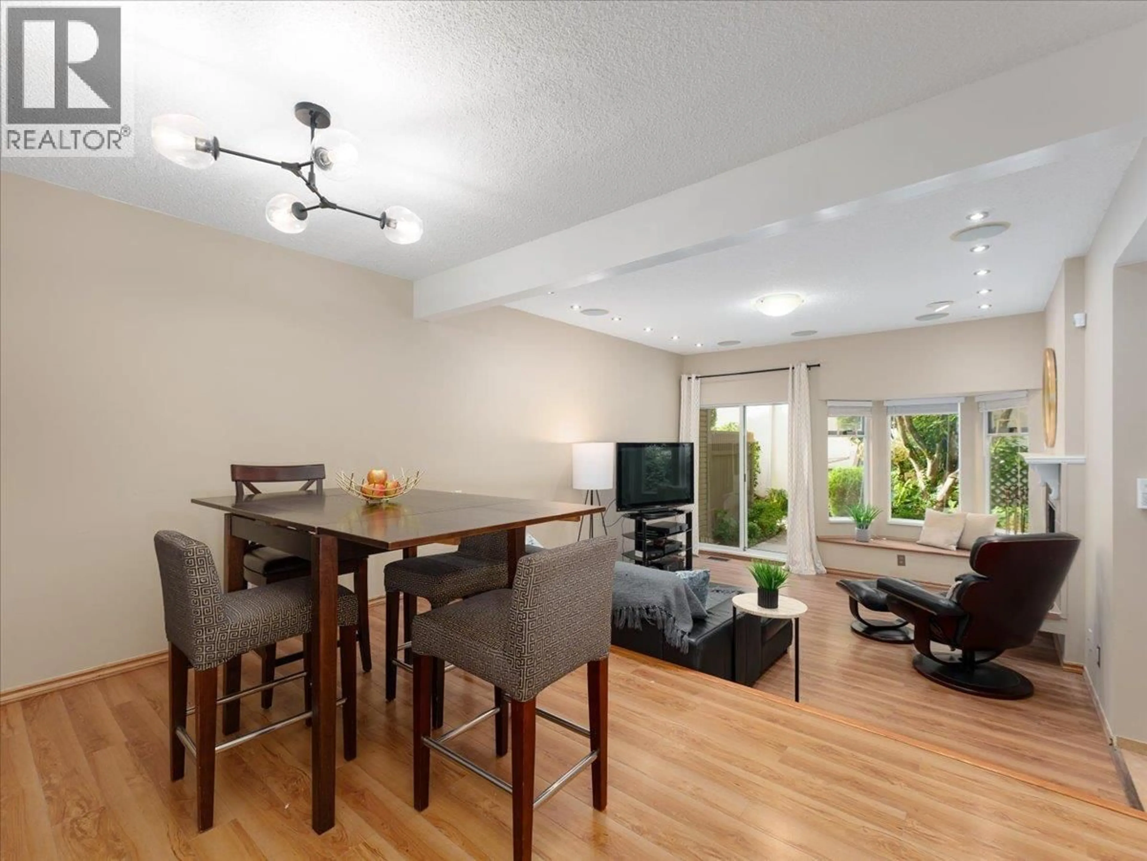 Living room with furniture, wood/laminate floor for 8804 ROBINS COURT, Burnaby British Columbia V5A4K7
