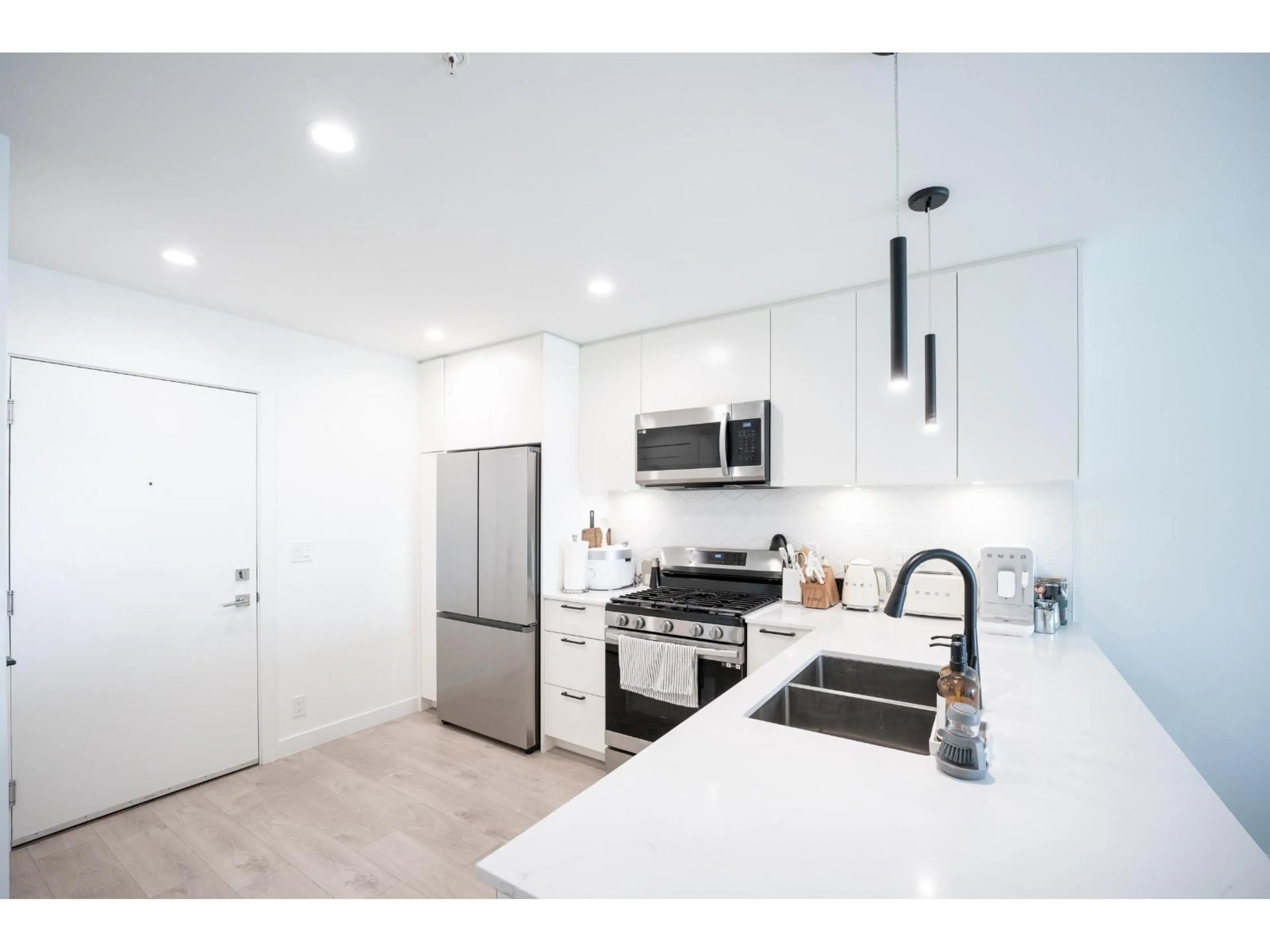 Open concept kitchen, unknown for 302 - 8380 200A, Langley British Columbia V2Y3S5