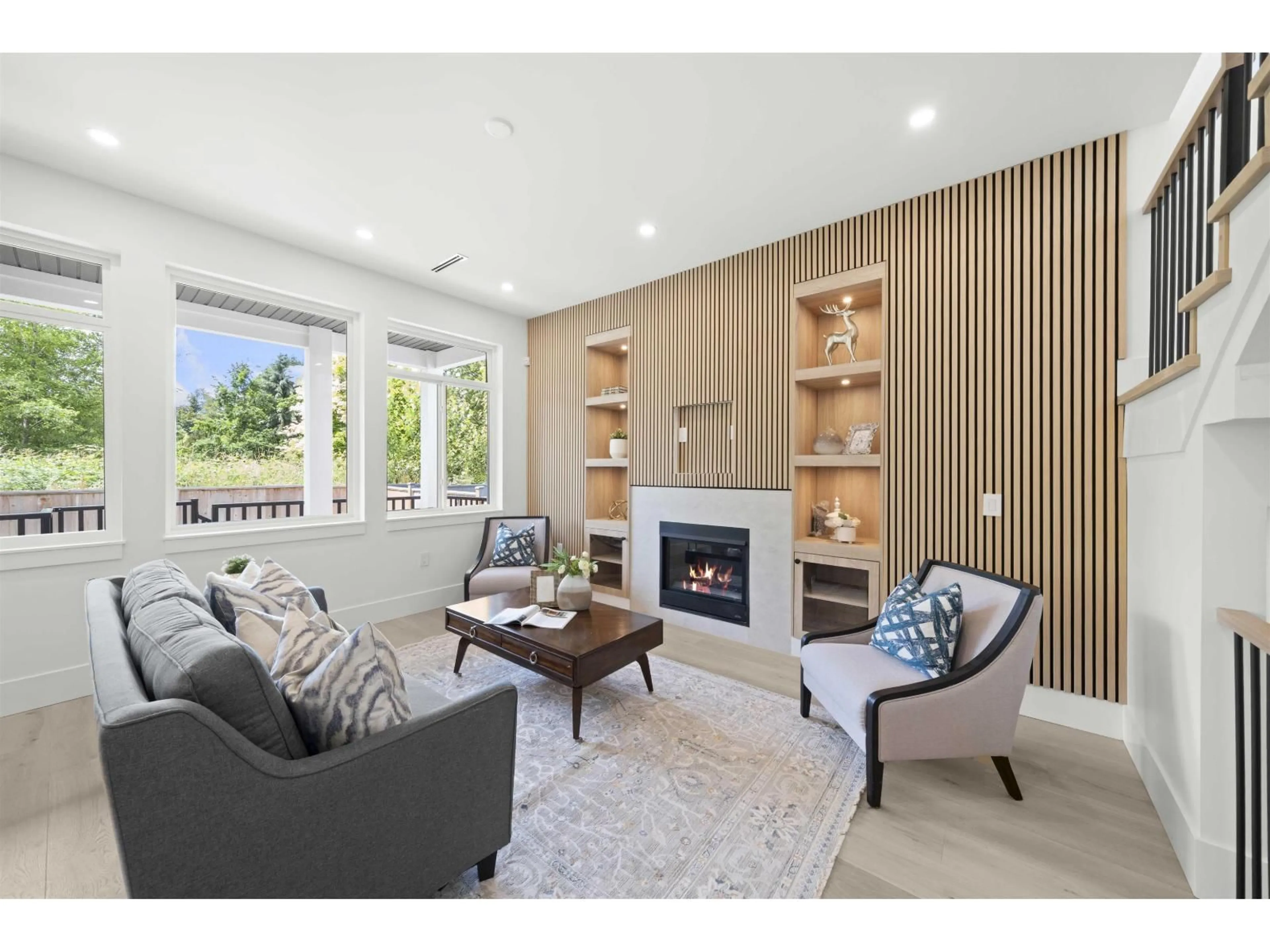Living room with furniture, wood/laminate floor for 7527 205, Langley British Columbia V2Y1V5