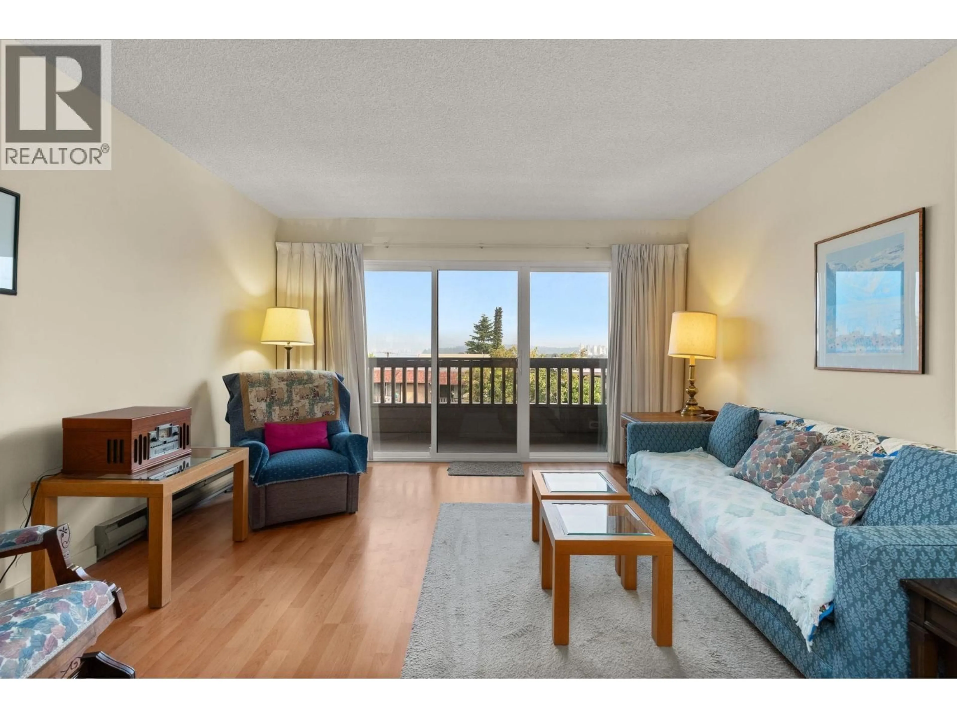 Living room with furniture, wood/laminate floor for 305 - 2100 3RD AVENUE, Vancouver British Columbia V6K1L1