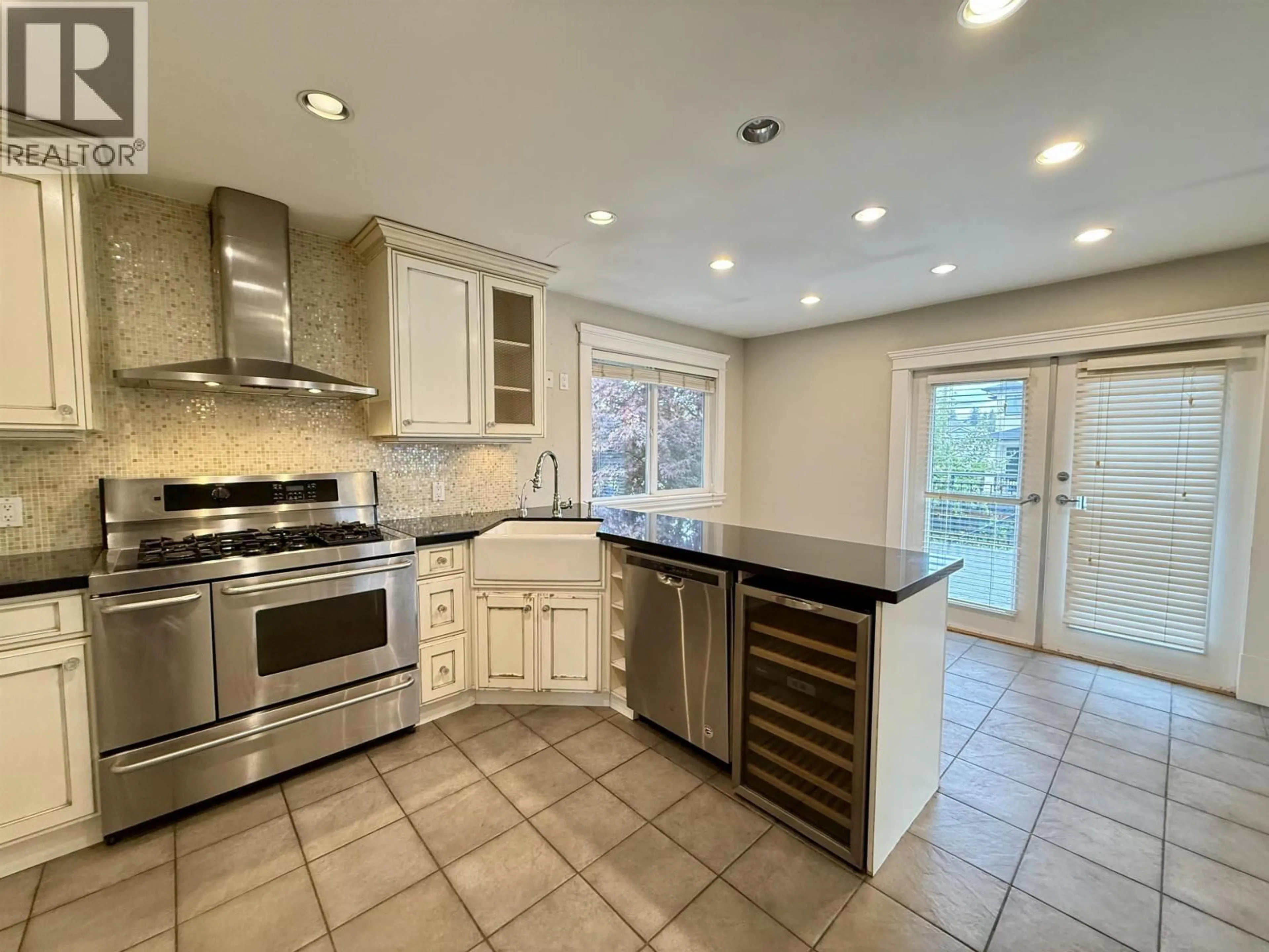 Open concept kitchen, ceramic/tile floor for 6525 CARNEGIE STREET, Burnaby British Columbia V5B1Y2