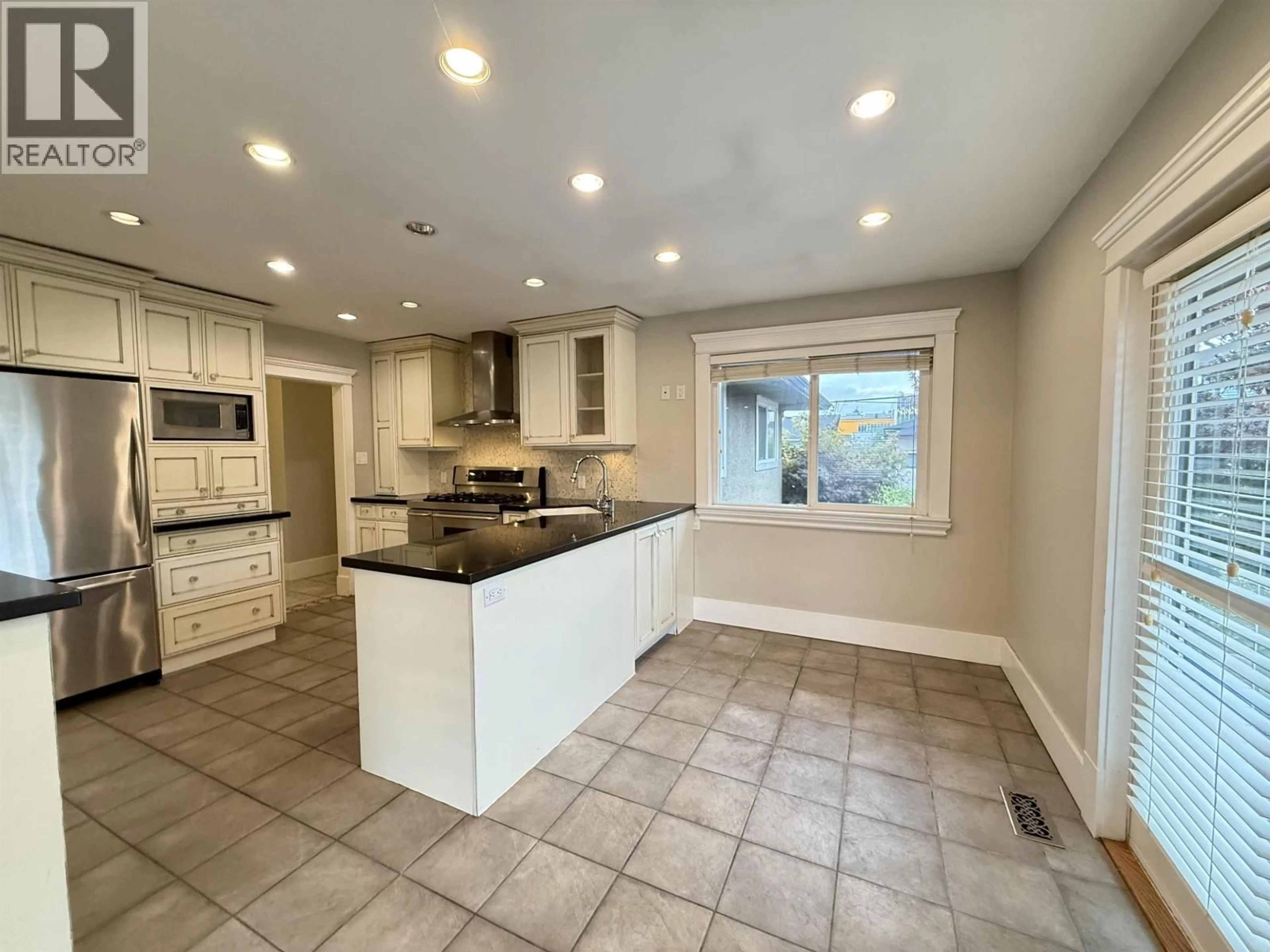 Open concept kitchen, ceramic/tile floor for 6525 CARNEGIE STREET, Burnaby British Columbia V5B1Y2