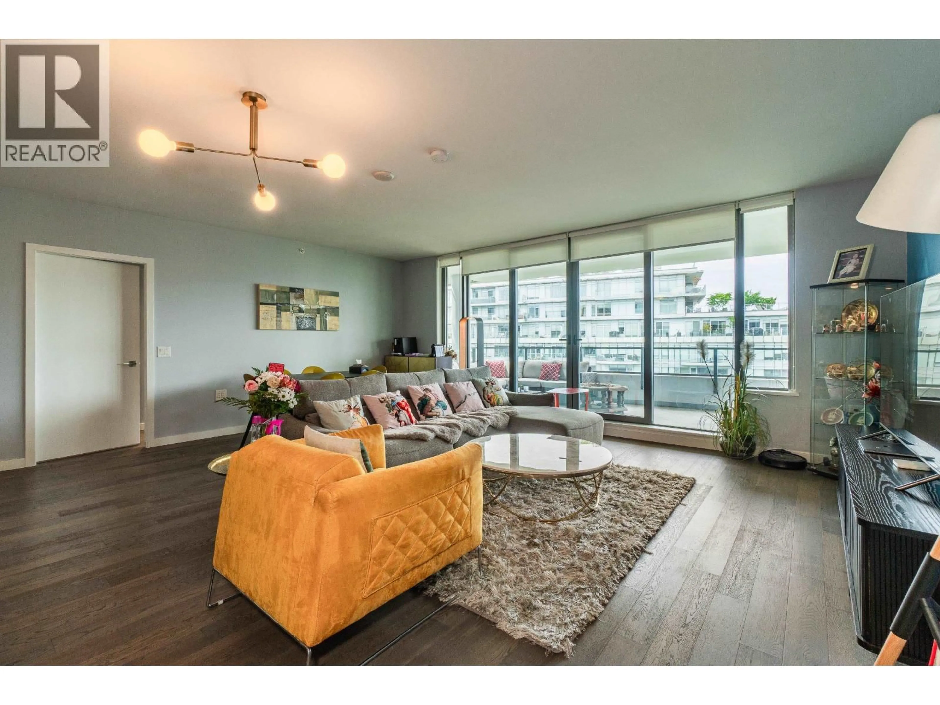 Living room with furniture, wood/laminate floor for 1106 - 1688 PULLMAN PORTER STREET, Vancouver British Columbia V6A0H3