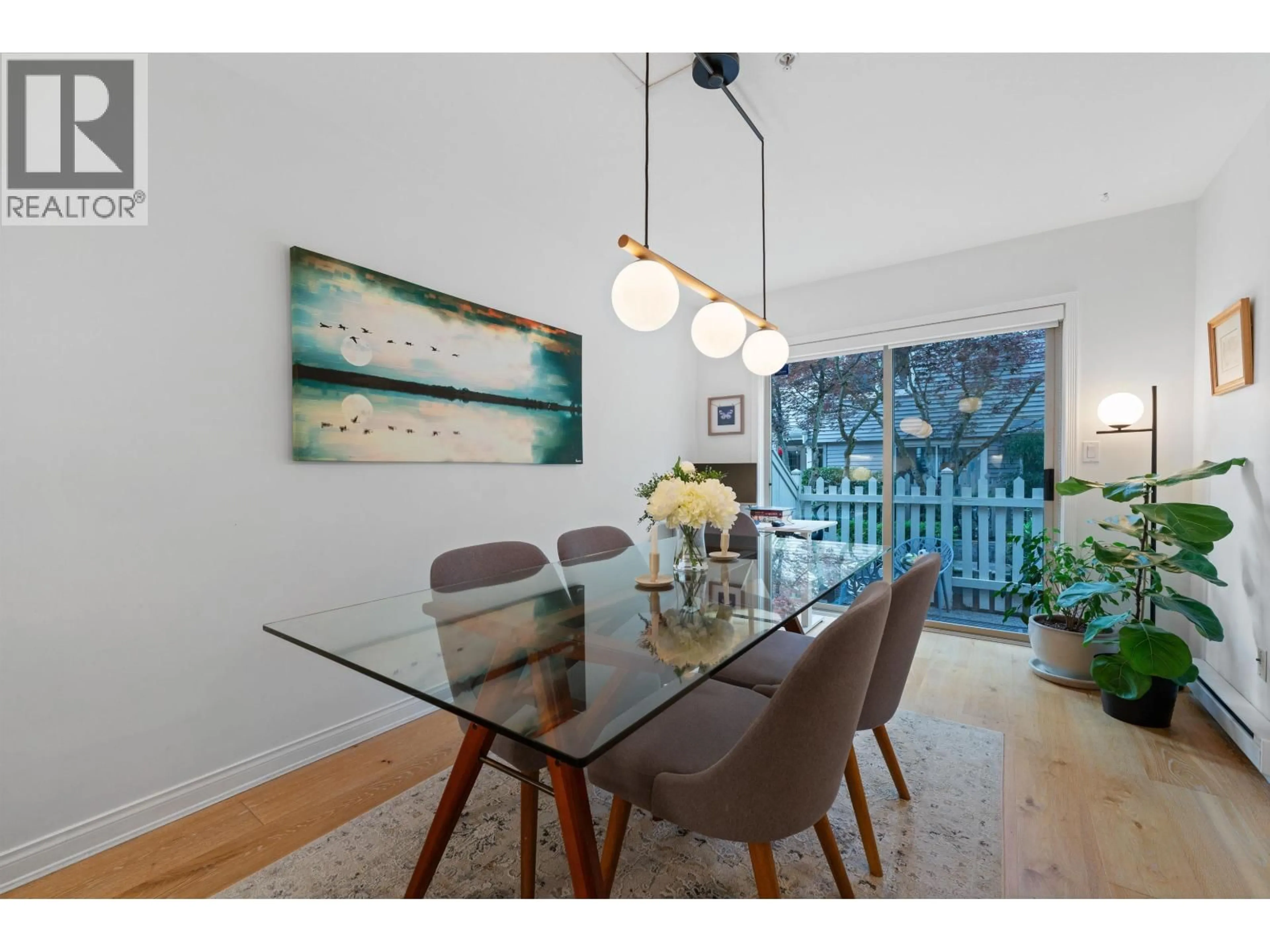 Dining room, wood/laminate floor for 10 - 222 5TH STREET, North Vancouver British Columbia V7L1L7
