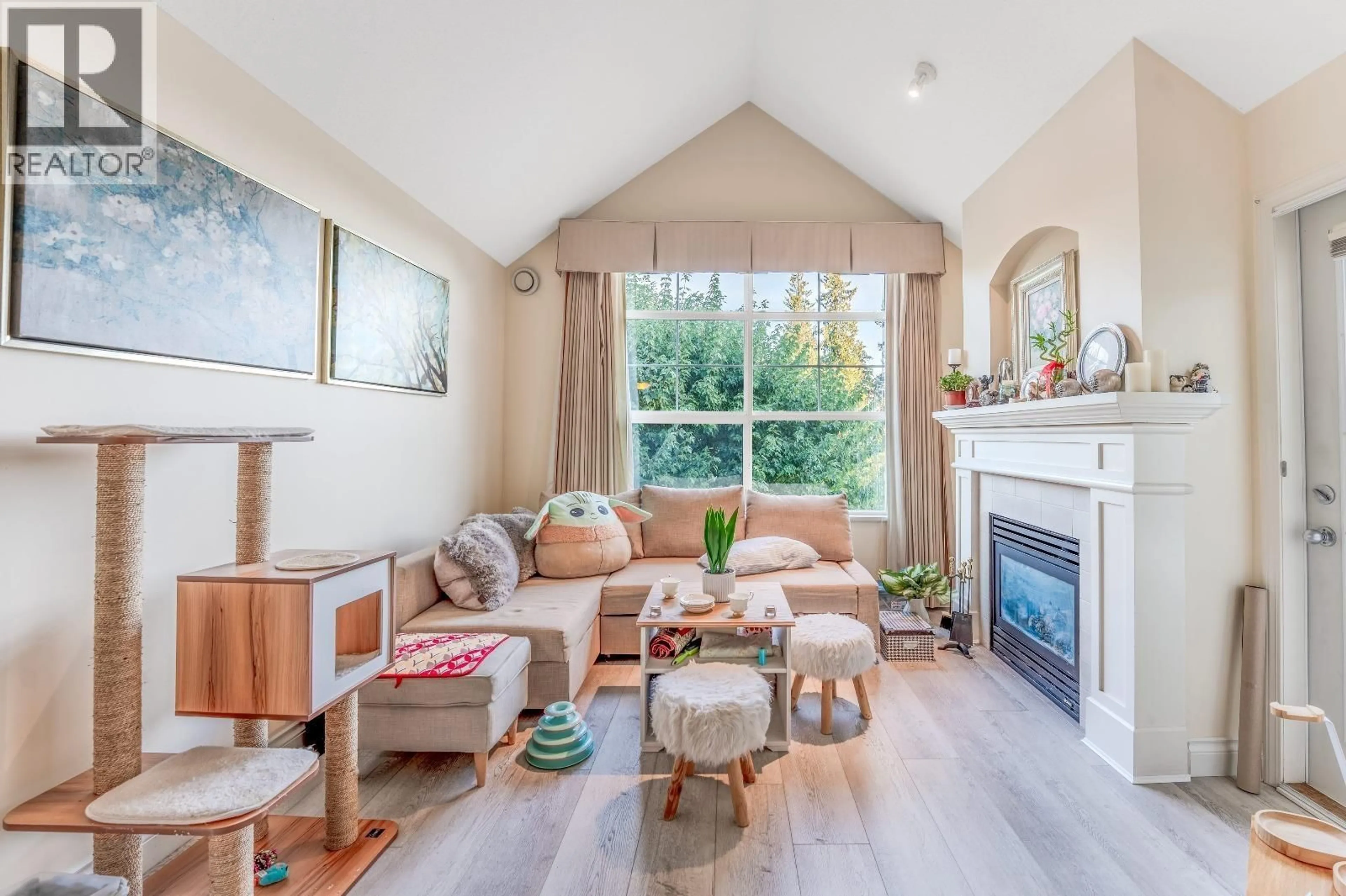 Living room with furniture, wood/laminate floor for 416 - 960 LYNN VALLEY ROAD, North Vancouver British Columbia V7J3V6