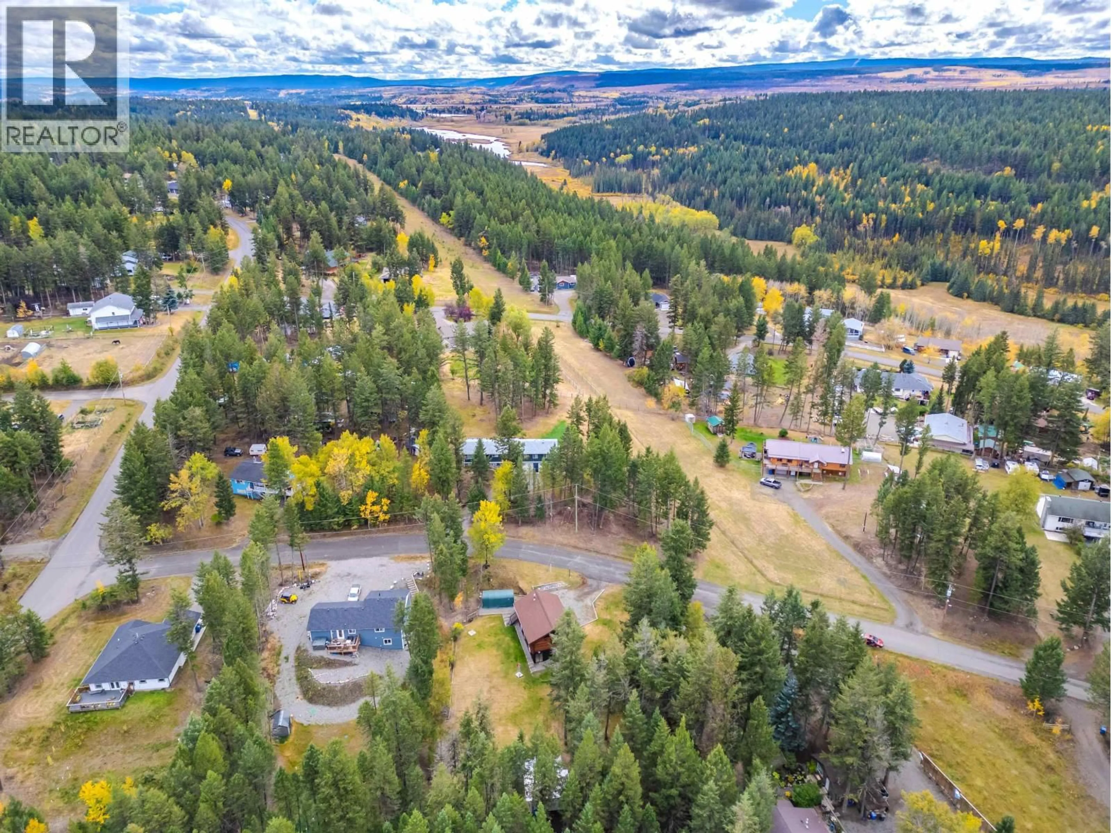 A pic from outside/outdoor area/front of a property/back of a property/a pic from drone, forest/trees view for 5231 DAVIS ROAD, 108 Mile Ranch British Columbia V0K2Z0