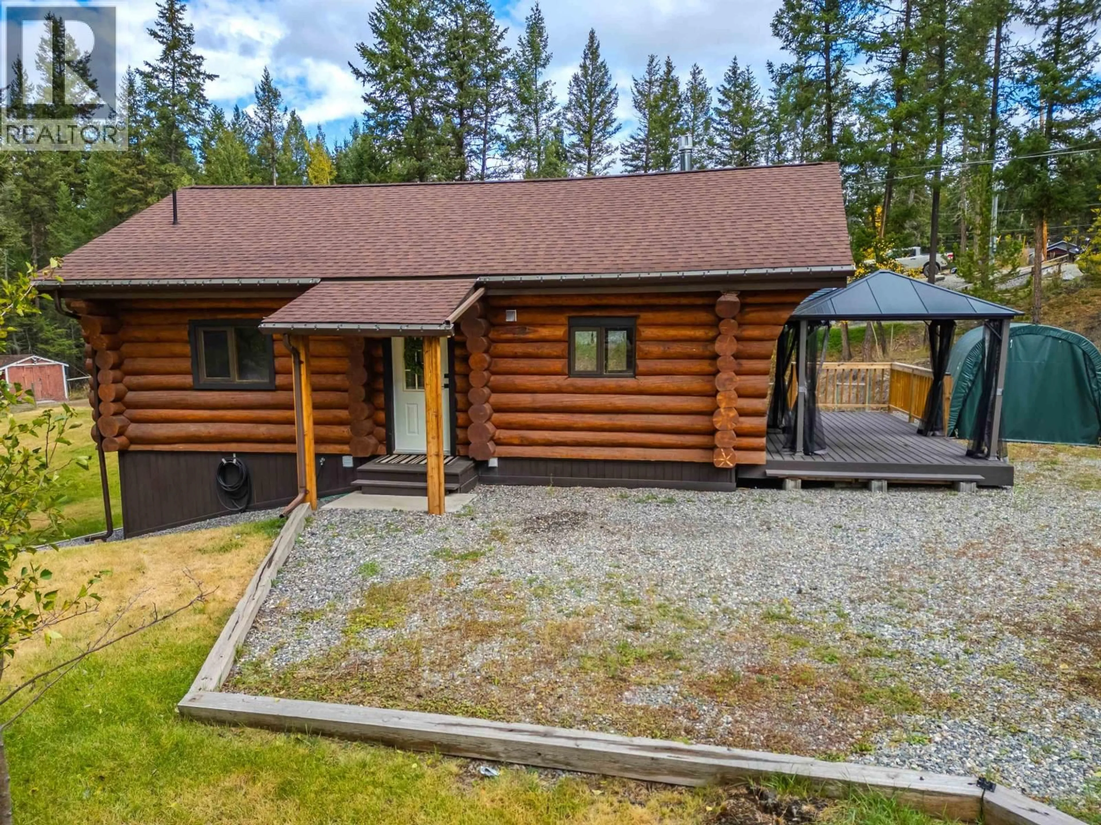 A pic from outside/outdoor area/front of a property/back of a property/a pic from drone, unknown for 5231 DAVIS ROAD, 108 Mile Ranch British Columbia V0K2Z0