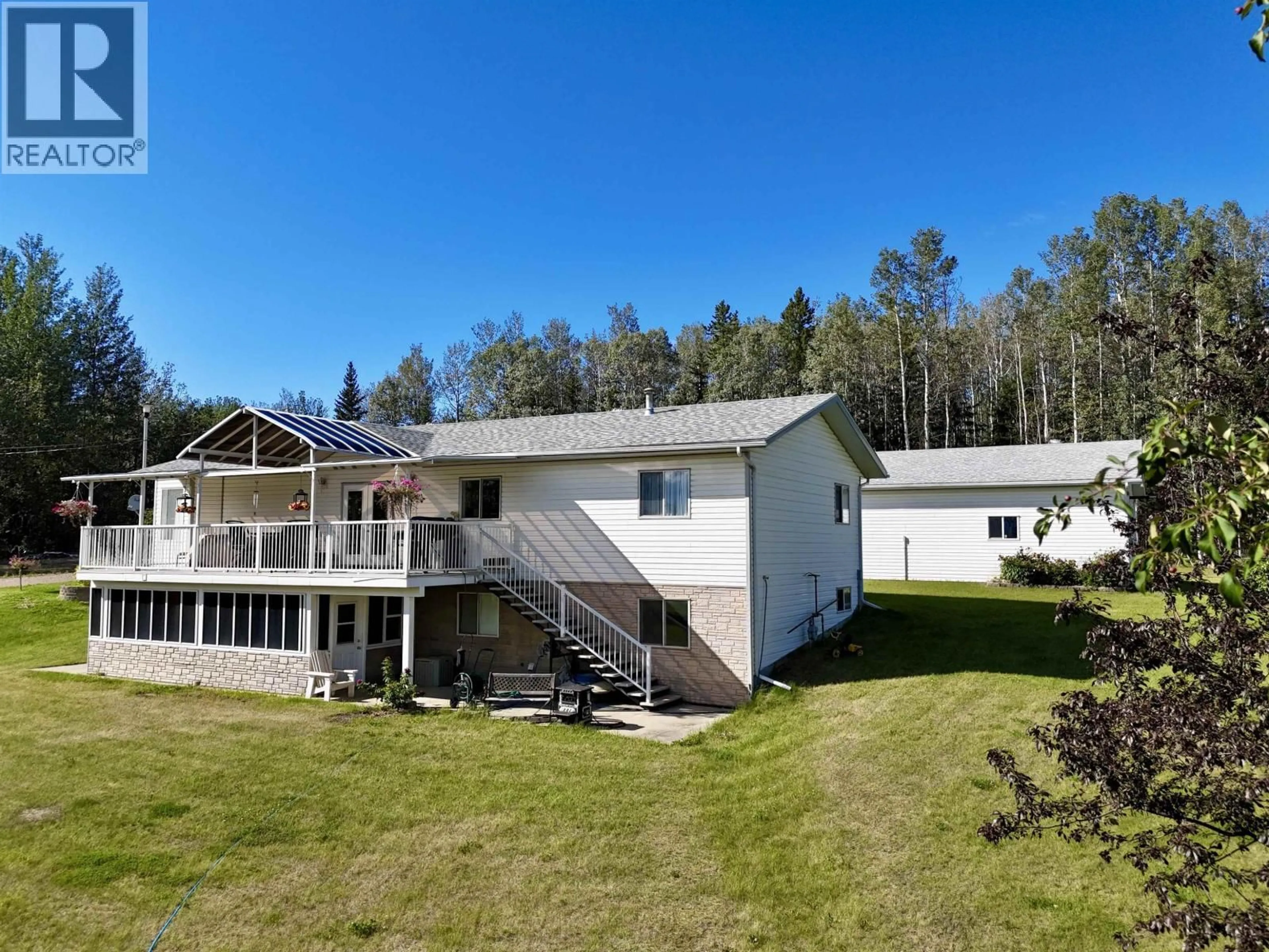A pic from outside/outdoor area/front of a property/back of a property/a pic from drone, building for 3 PEBBLE DRIVE, Fort Nelson British Columbia V0C1R0