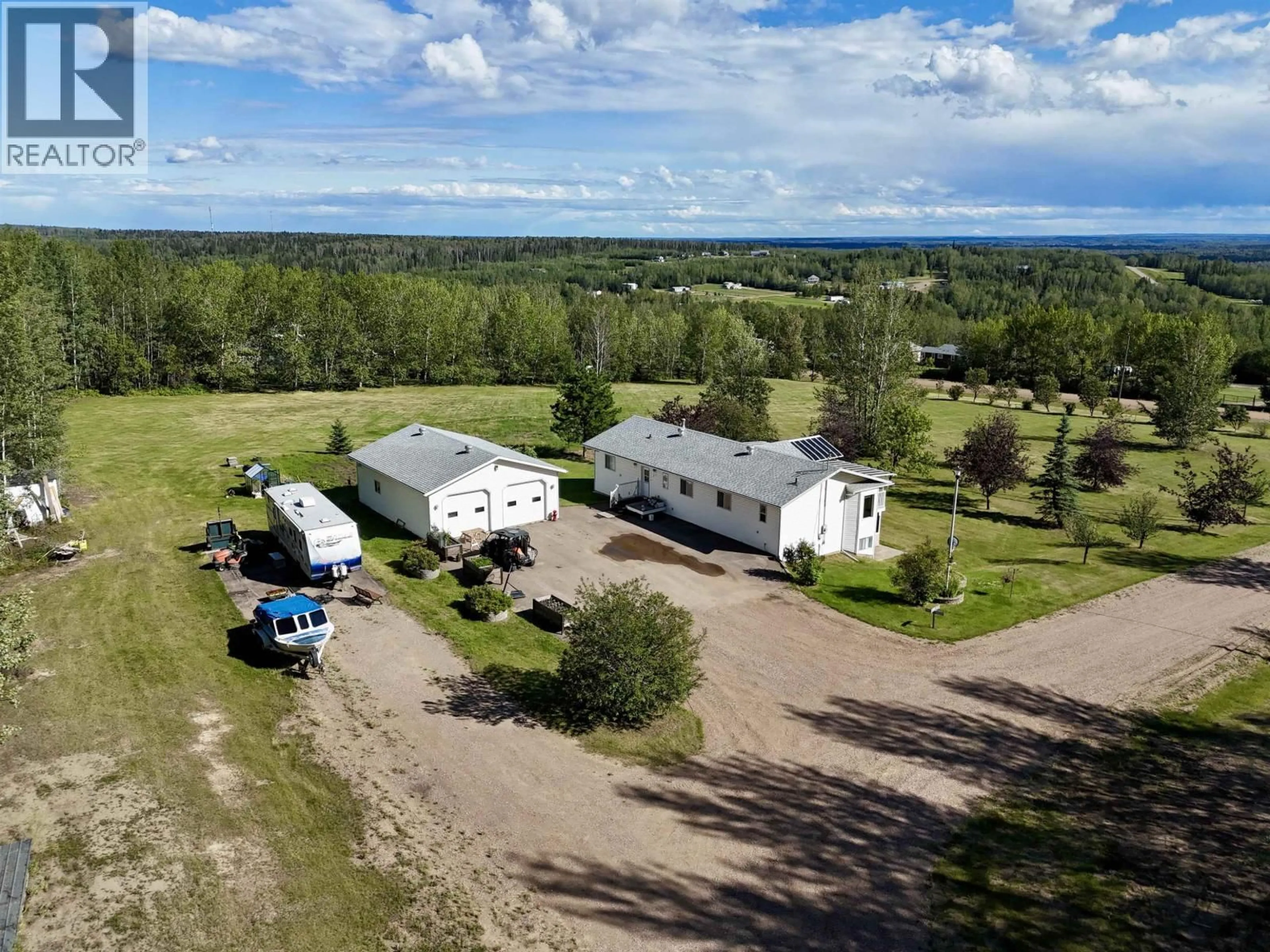 A pic from outside/outdoor area/front of a property/back of a property/a pic from drone, building for 3 PEBBLE DRIVE, Fort Nelson British Columbia V0C1R0
