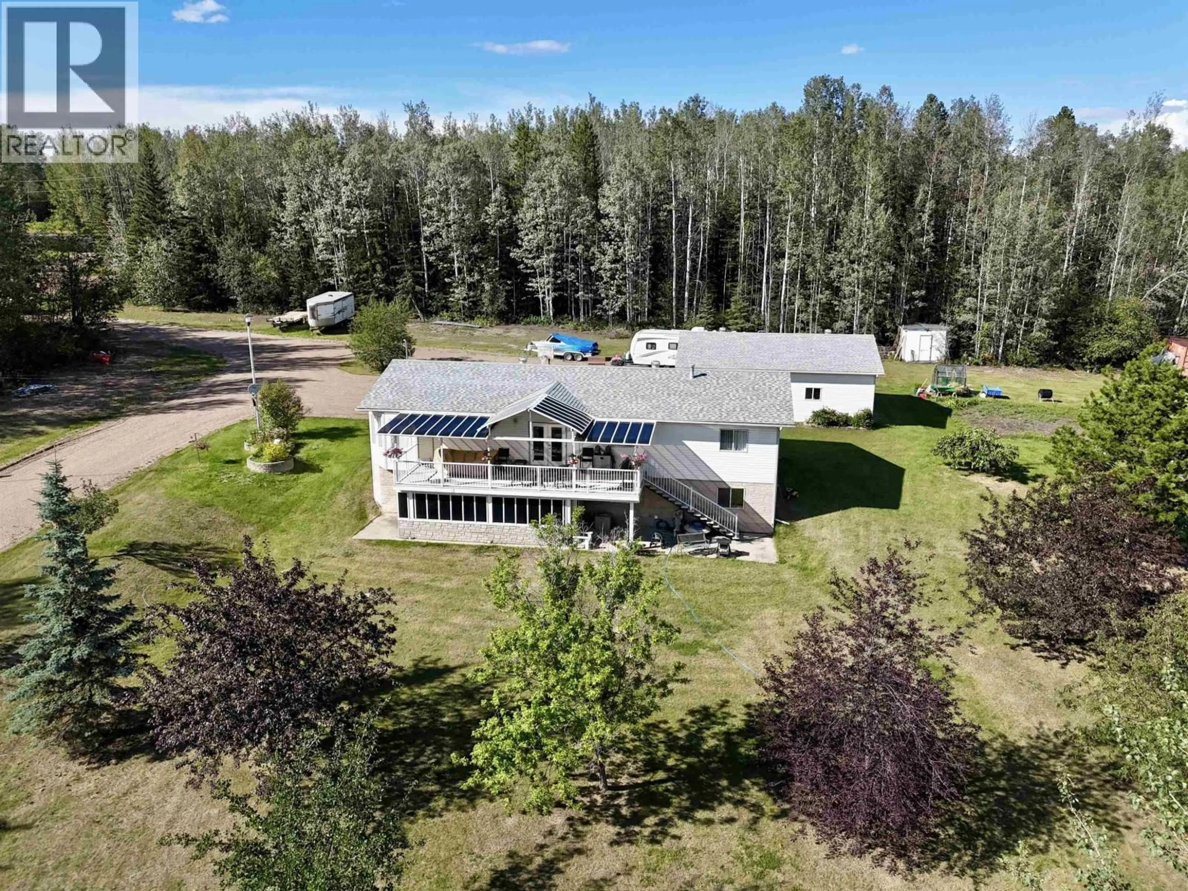 A pic from outside/outdoor area/front of a property/back of a property/a pic from drone, building for 3 PEBBLE DRIVE, Fort Nelson British Columbia V0C1R0
