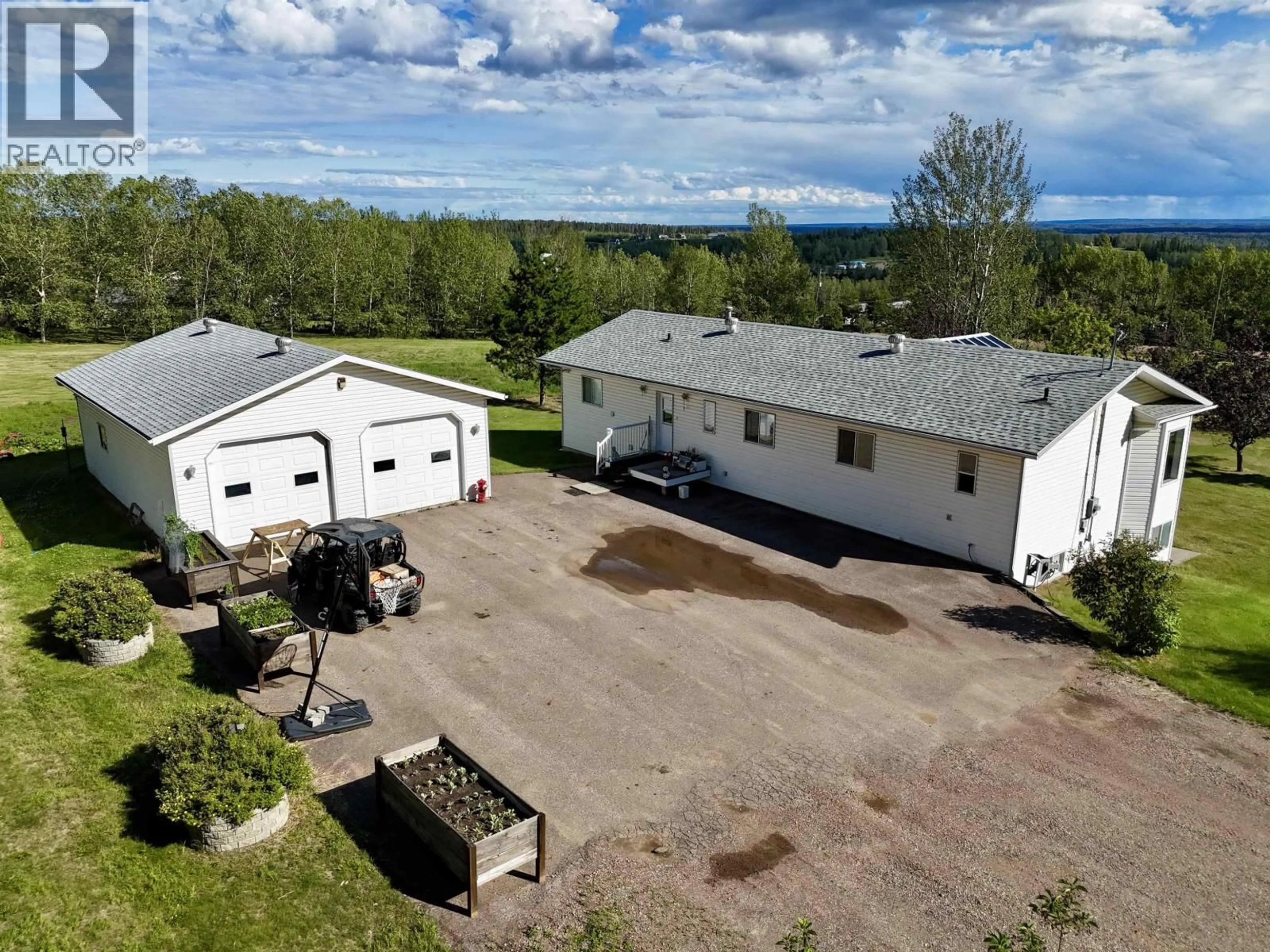 A pic from outside/outdoor area/front of a property/back of a property/a pic from drone, building for 3 PEBBLE DRIVE, Fort Nelson British Columbia V0C1R0