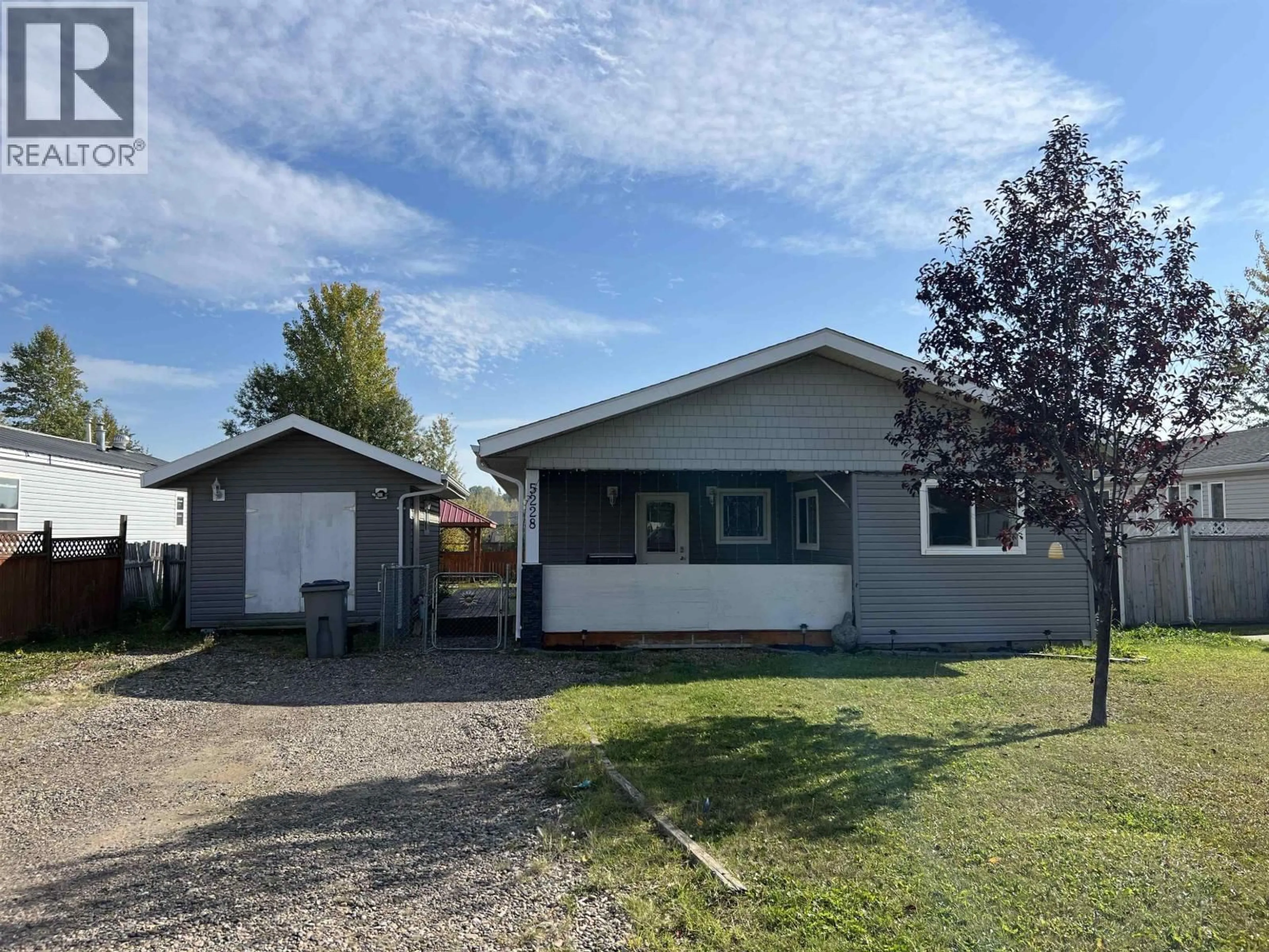 Home with vinyl exterior material, street for 5228 40TH STREET, Fort Nelson British Columbia V0C1R0