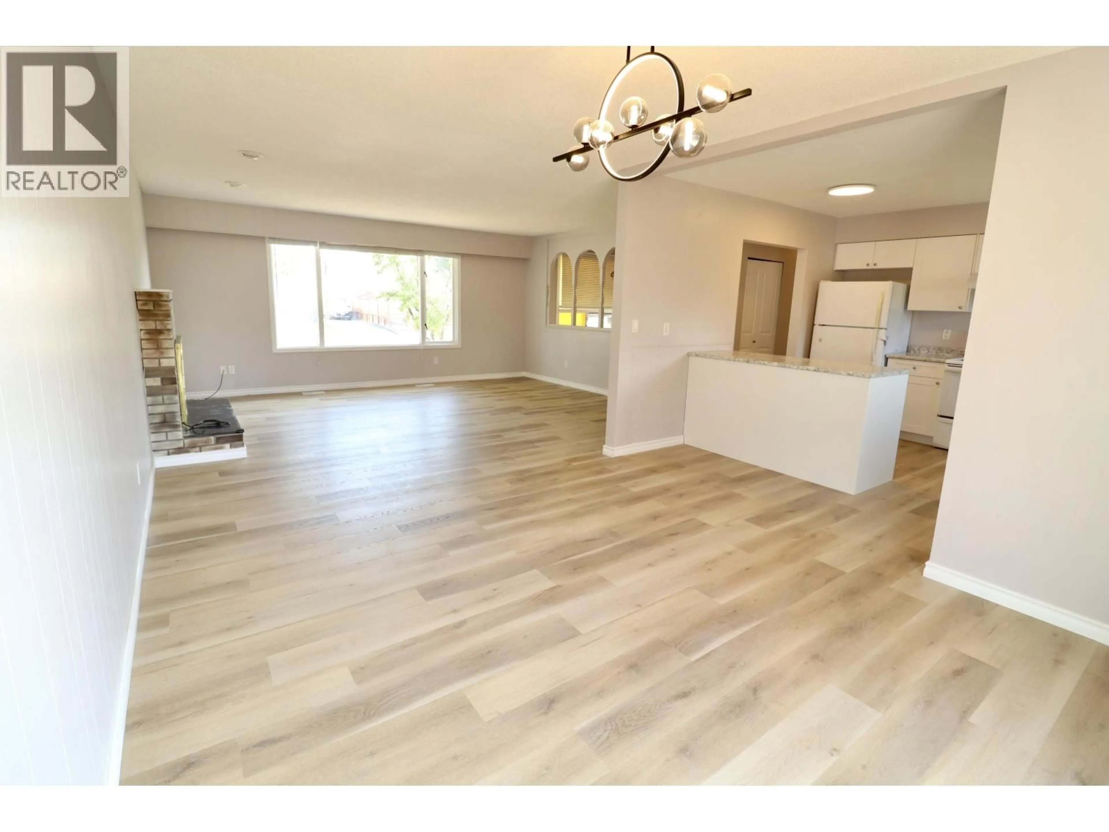Open concept kitchen, wood/laminate floor for 4523 HUNTER AVENUE, Prince George British Columbia V2M5V7