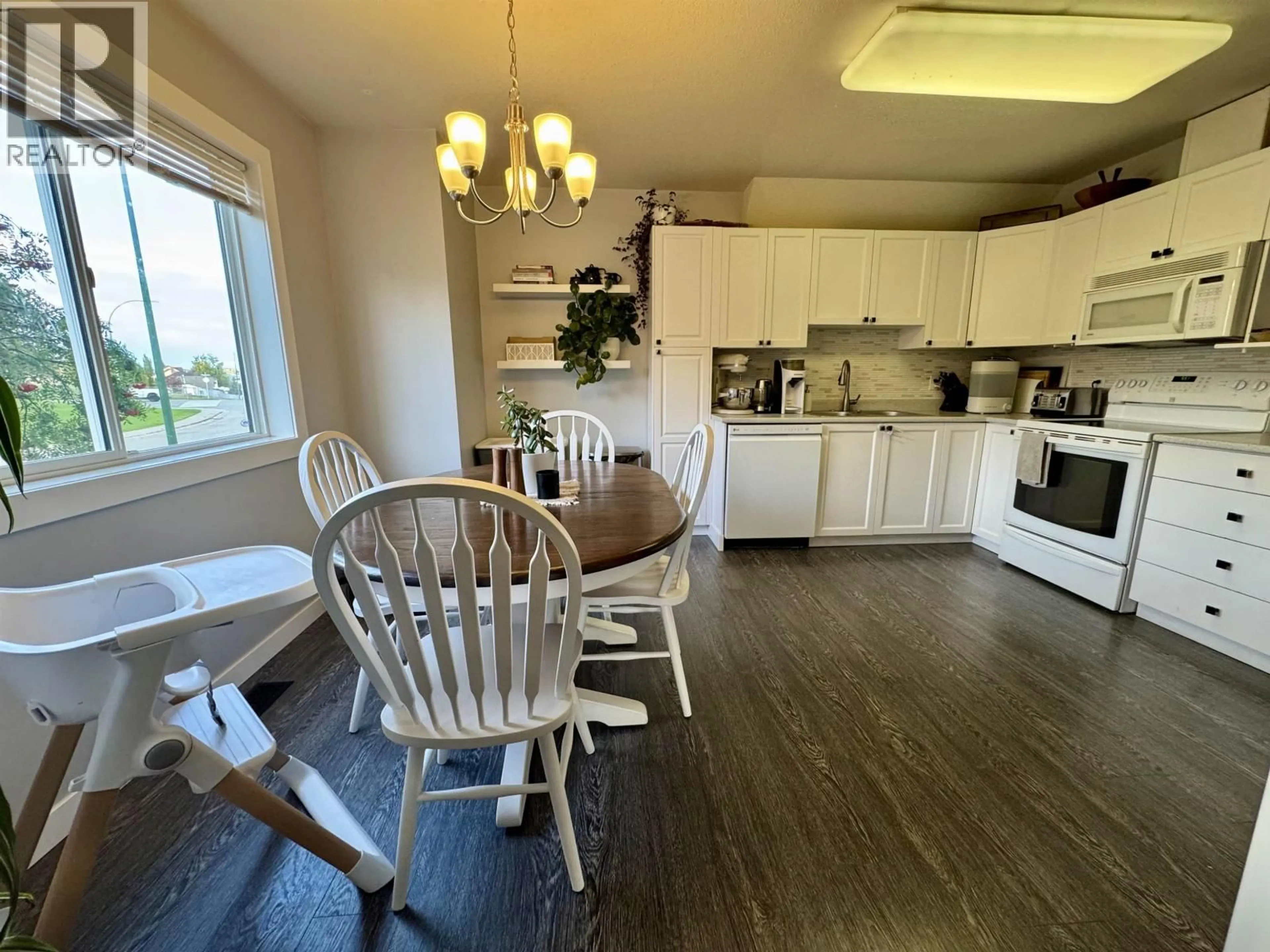 Open concept kitchen, wood/laminate floor for 105 - 3015 ST ANNE CRESCENT, Prince George British Columbia V2N5M3