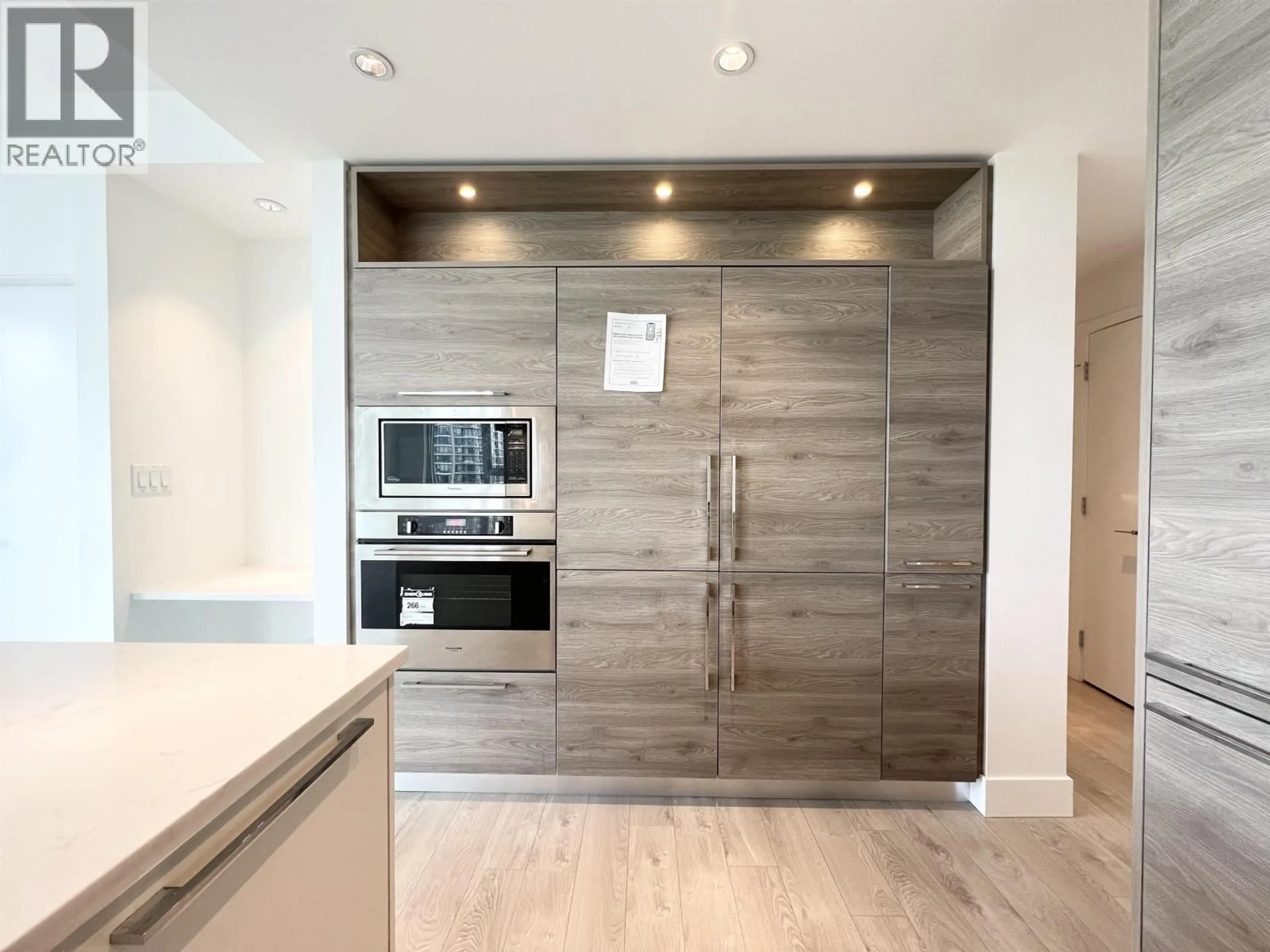 Contemporary kitchen, wood/laminate floor for 902 - 7303 NOBLE LANE, Burnaby British Columbia V3N0H2