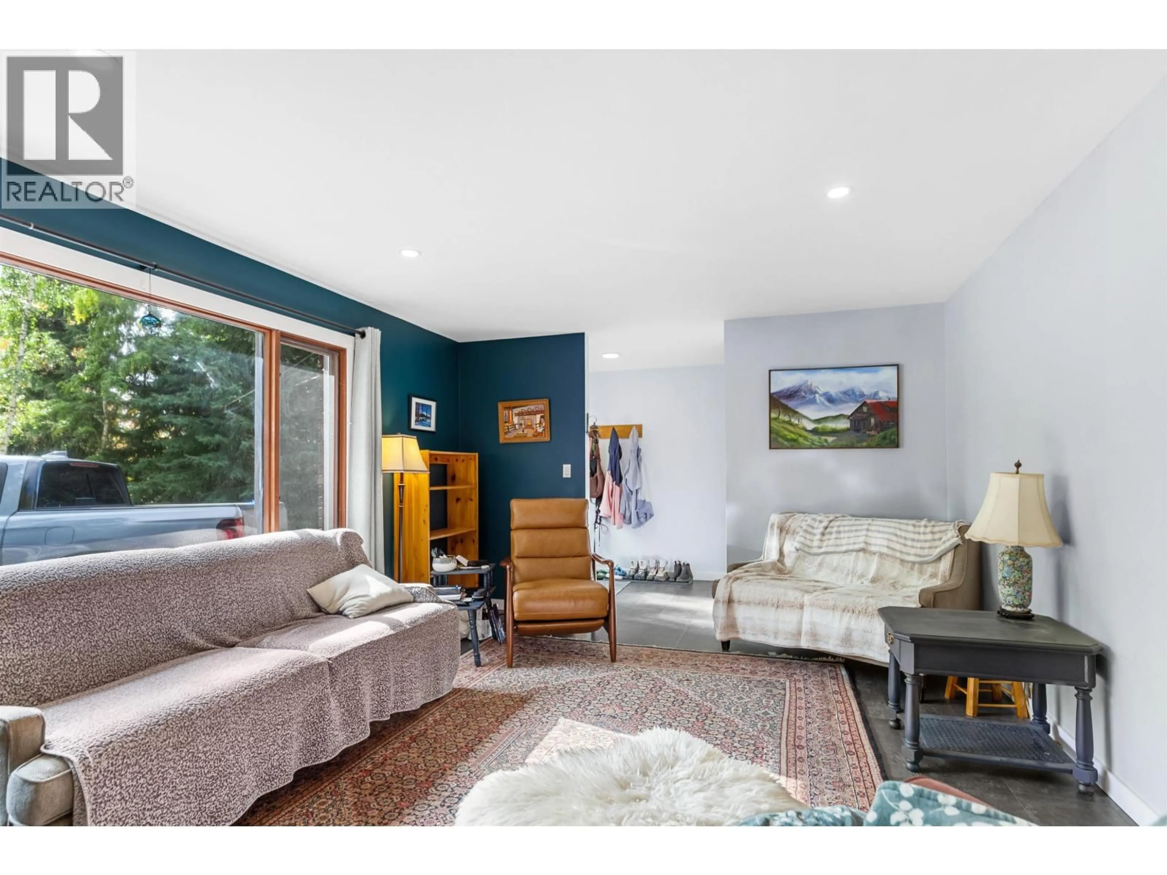 Living room with furniture, wood/laminate floor for 6190 GISCOME ROAD, Prince George British Columbia V2N6T4