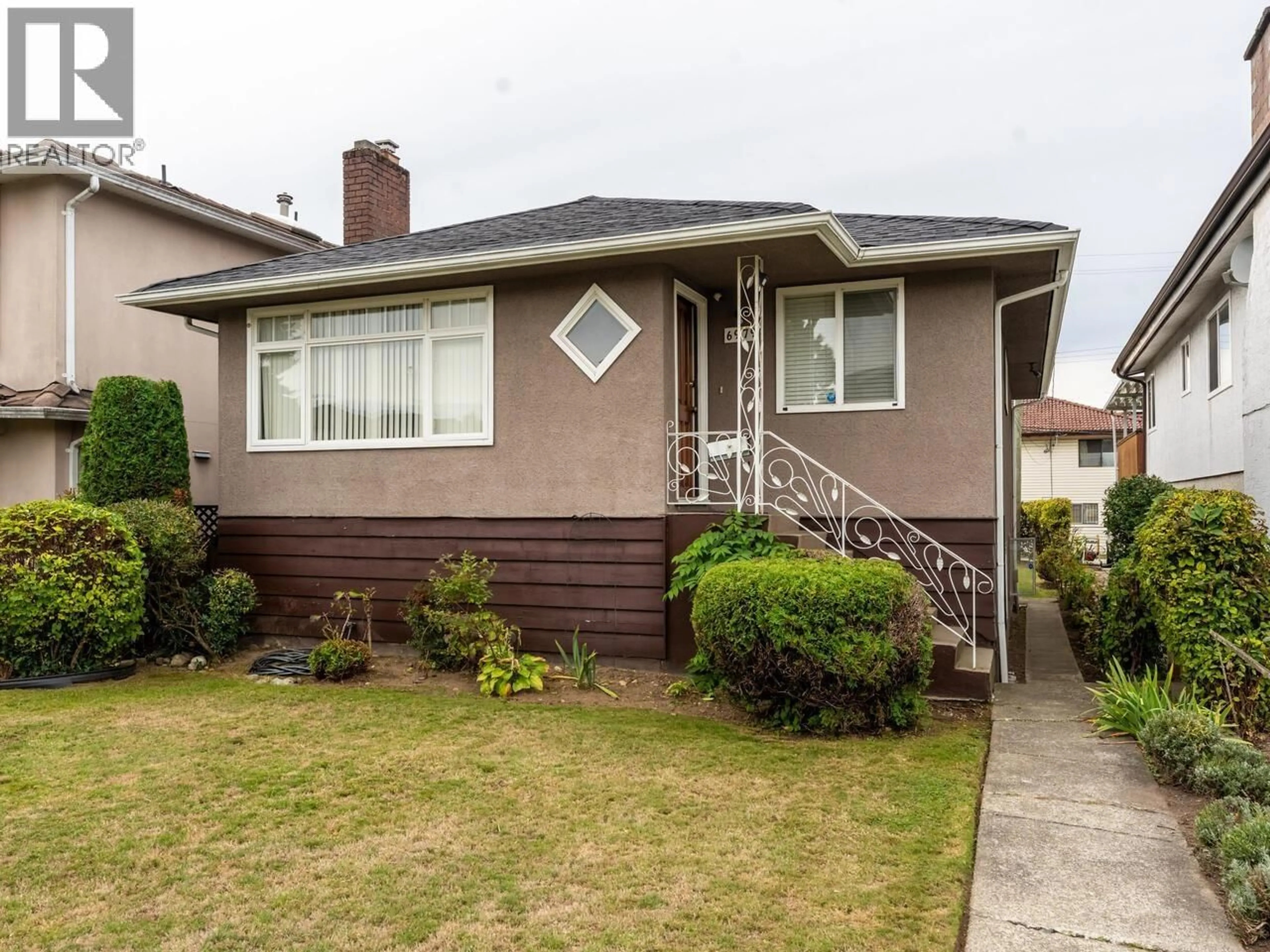 Home with vinyl exterior material, street for 6979 GLADSTONE STREET, Vancouver British Columbia V5P4G4