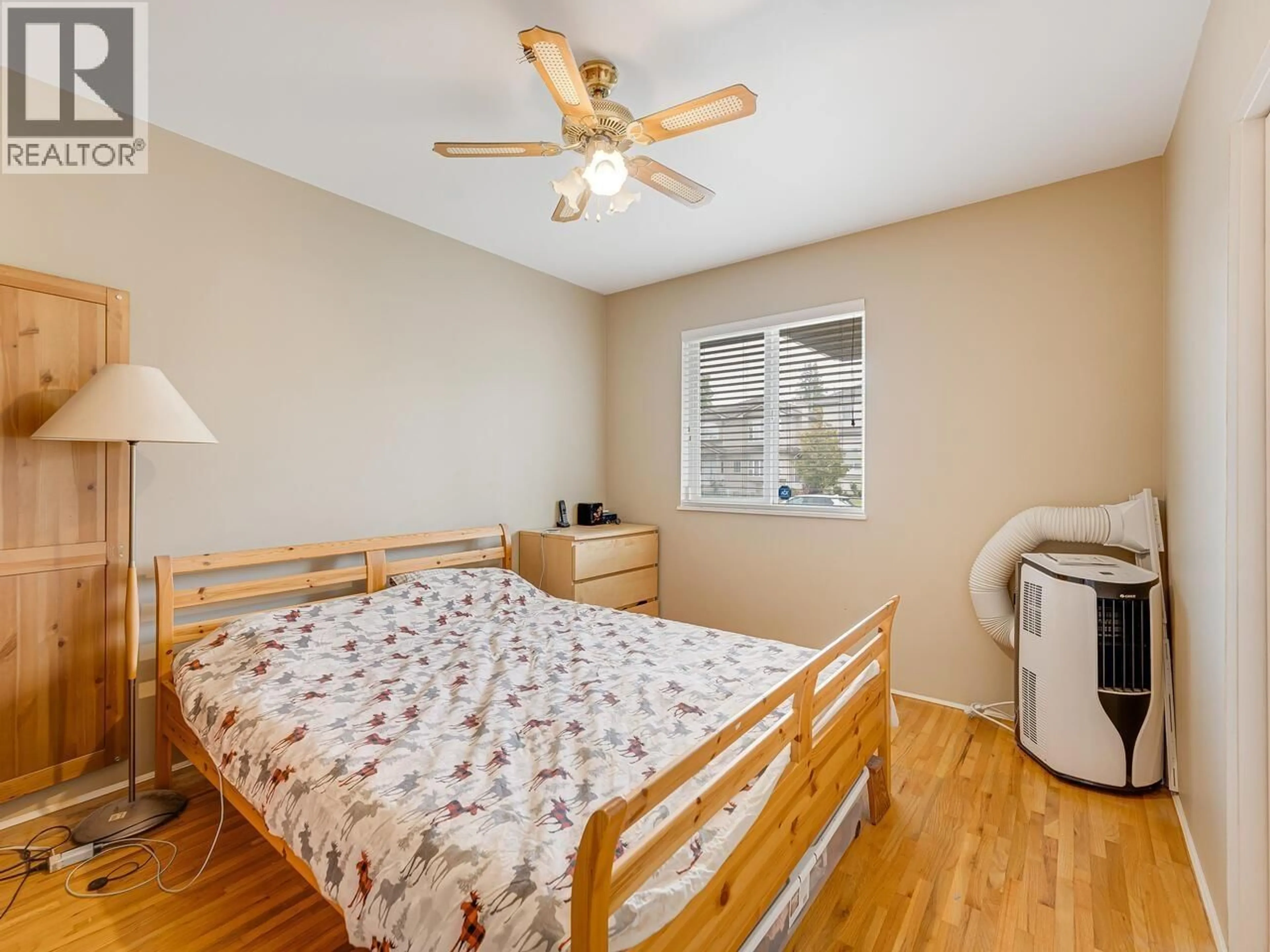 Bedroom with bed, wood/laminate floor for 6979 GLADSTONE STREET, Vancouver British Columbia V5P4G4