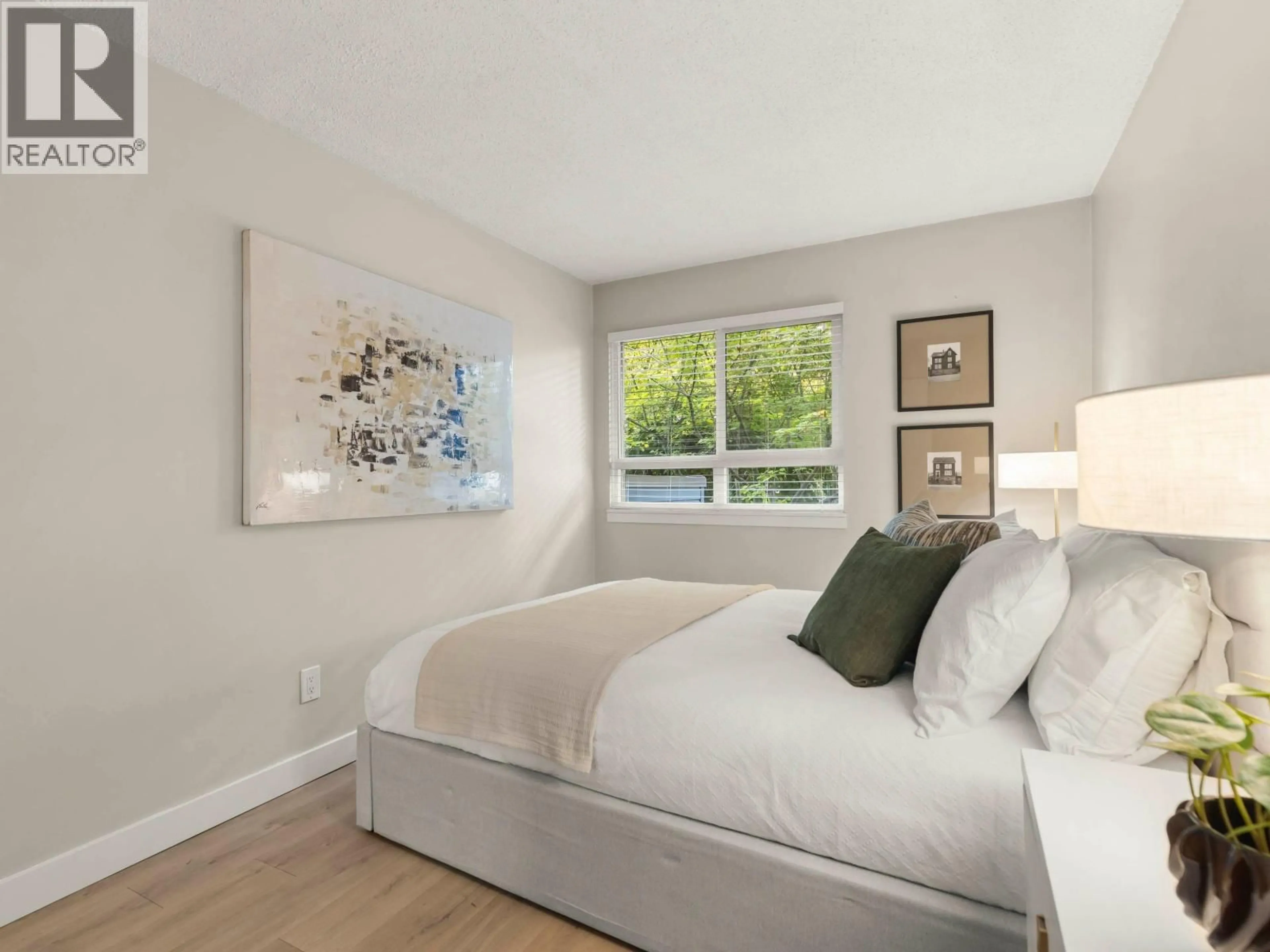 Bedroom with bed, wood/laminate floor for 216 - 1990 6TH AVENUE, Vancouver British Columbia V6J4V4