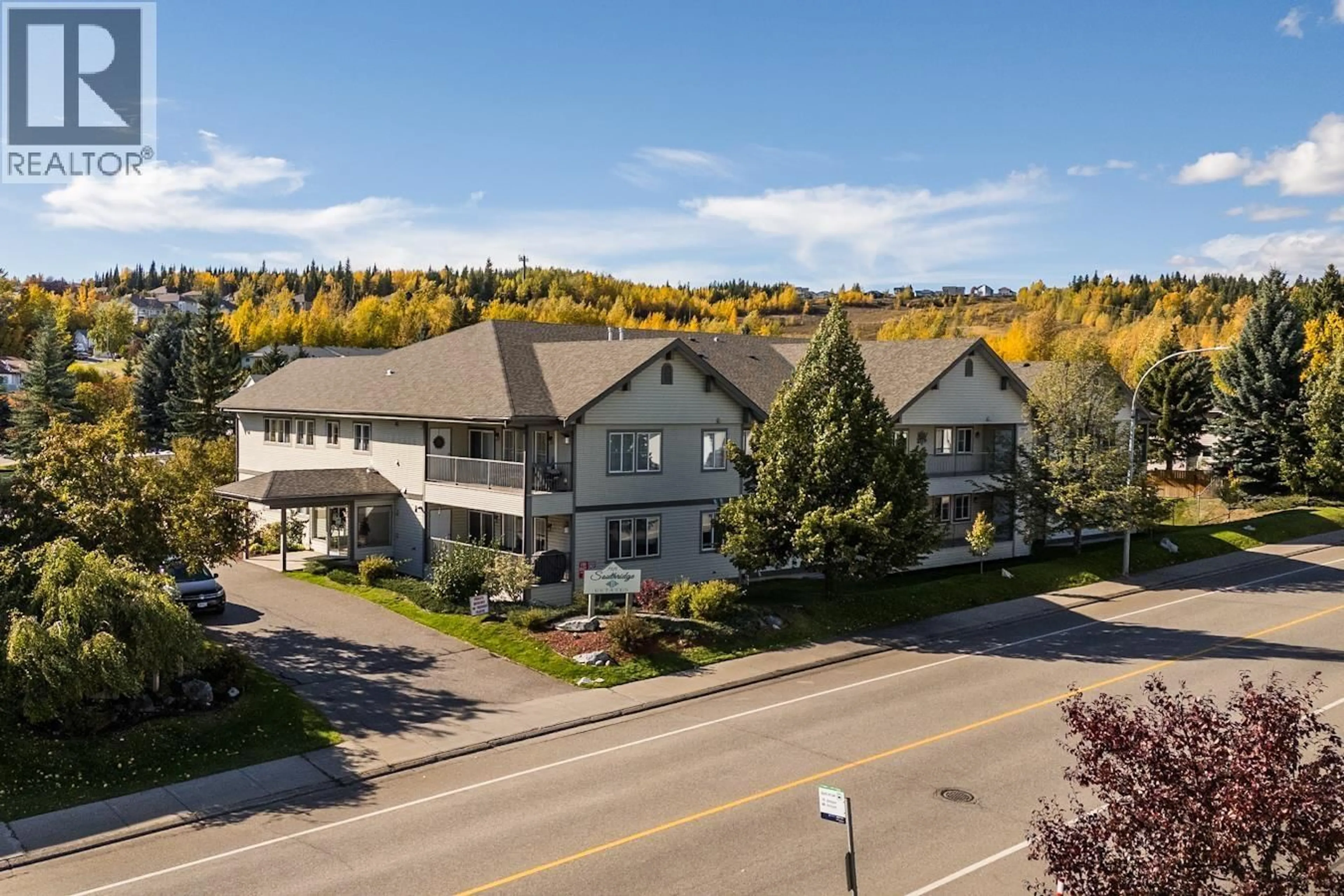 A pic from outside/outdoor area/front of a property/back of a property/a pic from drone, mountain view for 102 - 7215 SOUTHRIDGE AVENUE, Prince George British Columbia V2N4Z3