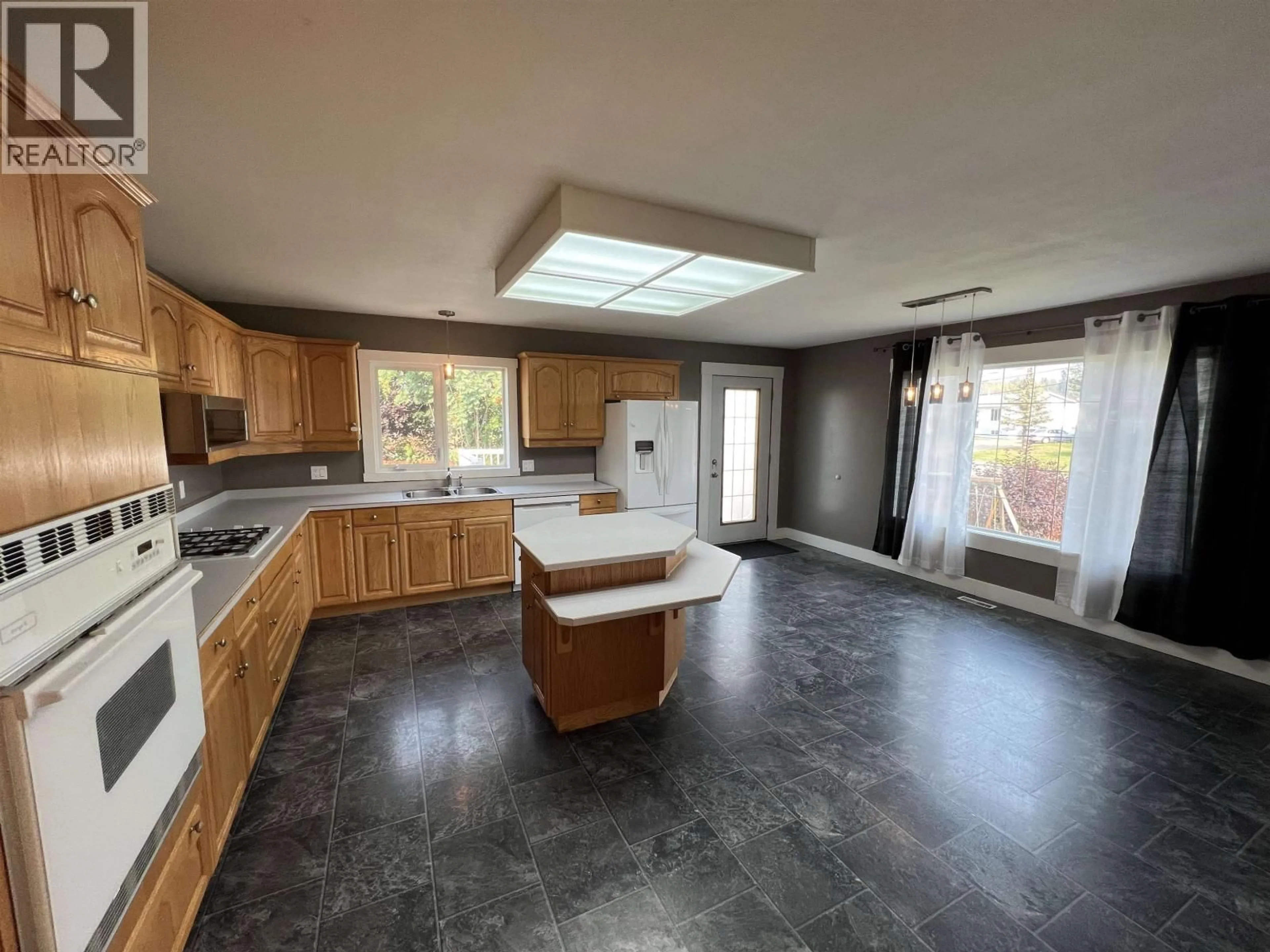 Open concept kitchen, ceramic/tile floor for 3912 COTTONWOOD ROAD, Fort Nelson British Columbia V0C1R0