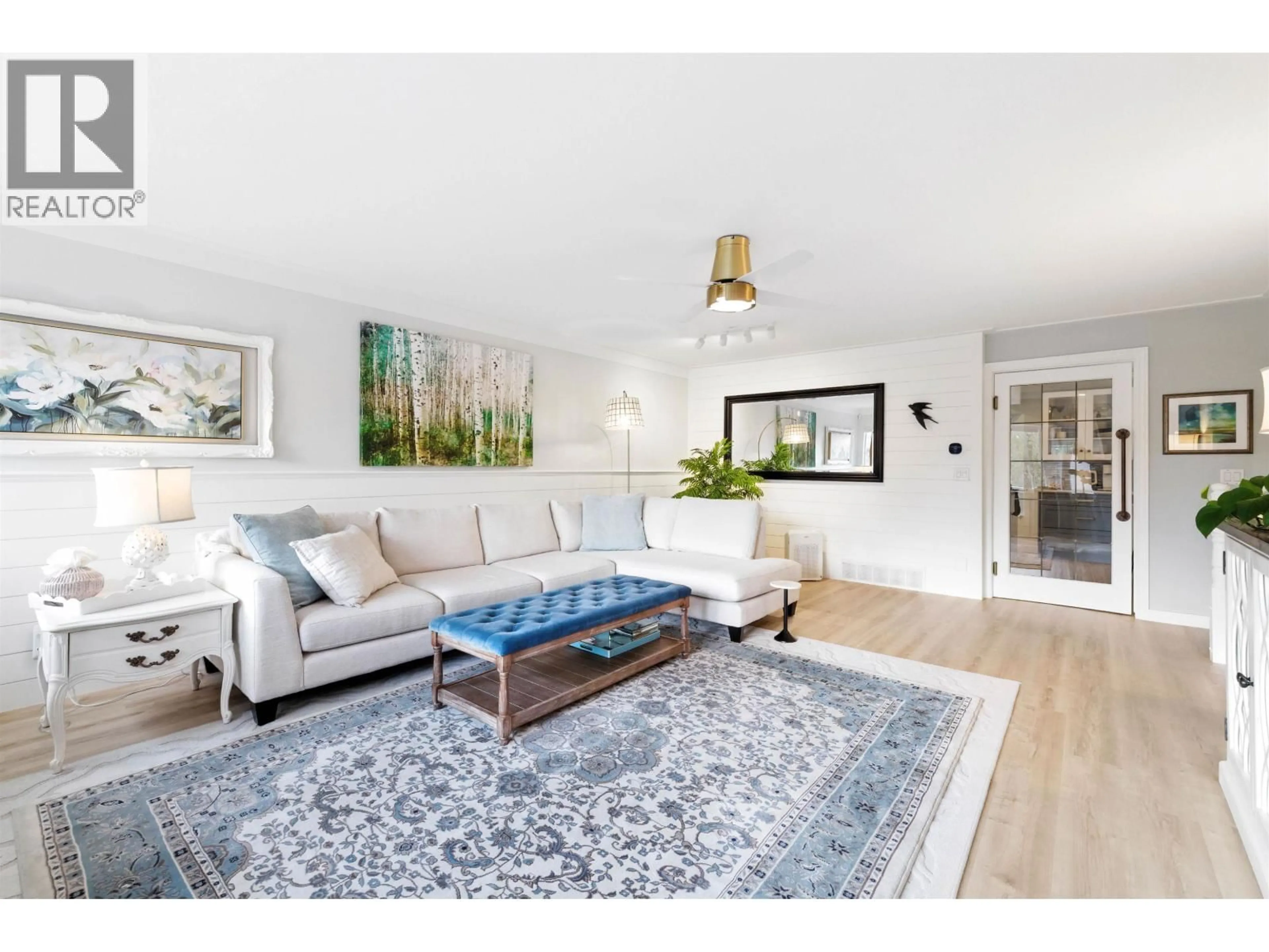 Living room with furniture, wood/laminate floor for 8885 LARKFIELD DRIVE, Burnaby British Columbia V5A4L3