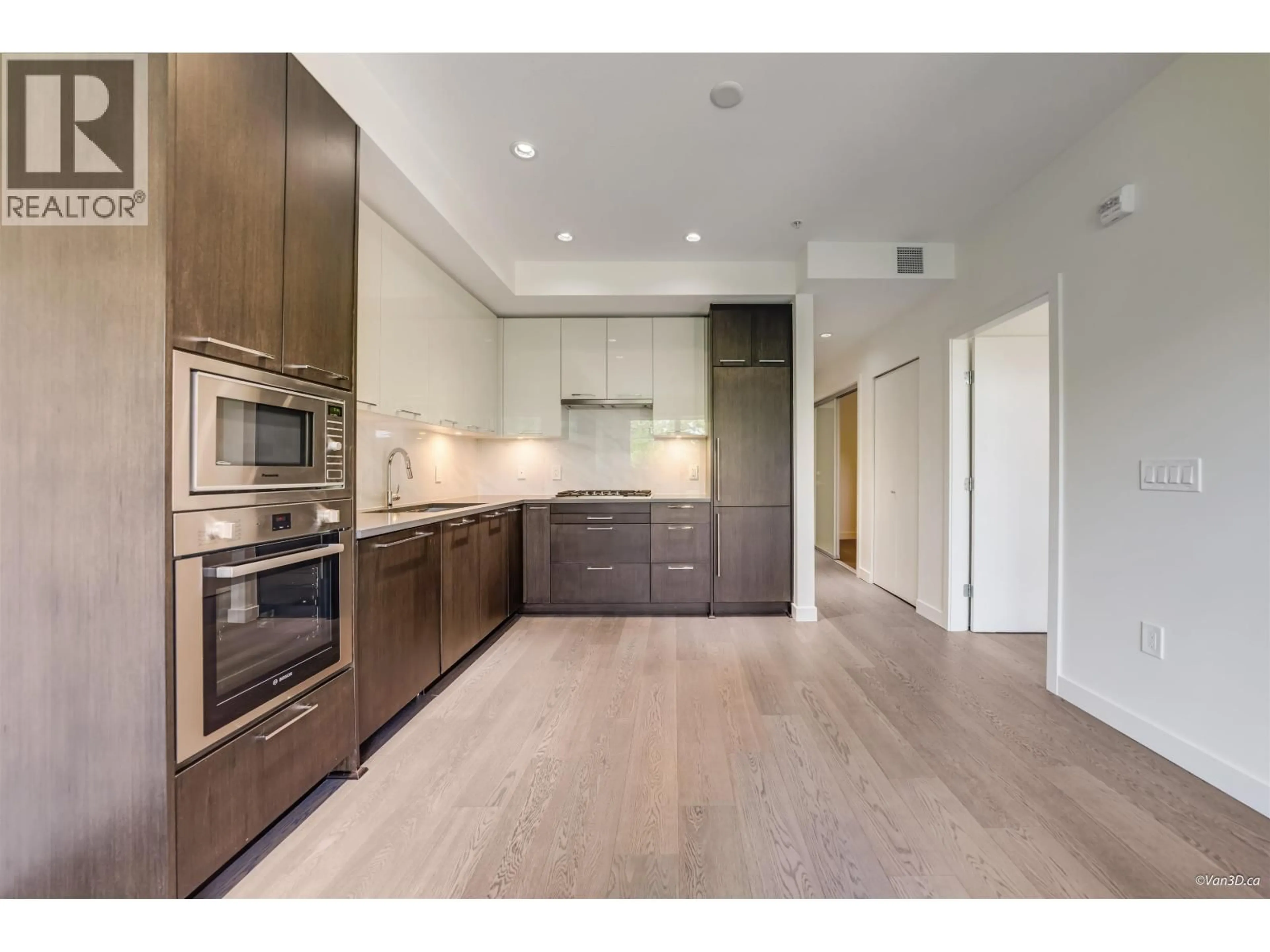 Open concept kitchen, wood/laminate floor for 107 - 4033 MAY DRIVE, Richmond British Columbia V6X0T3