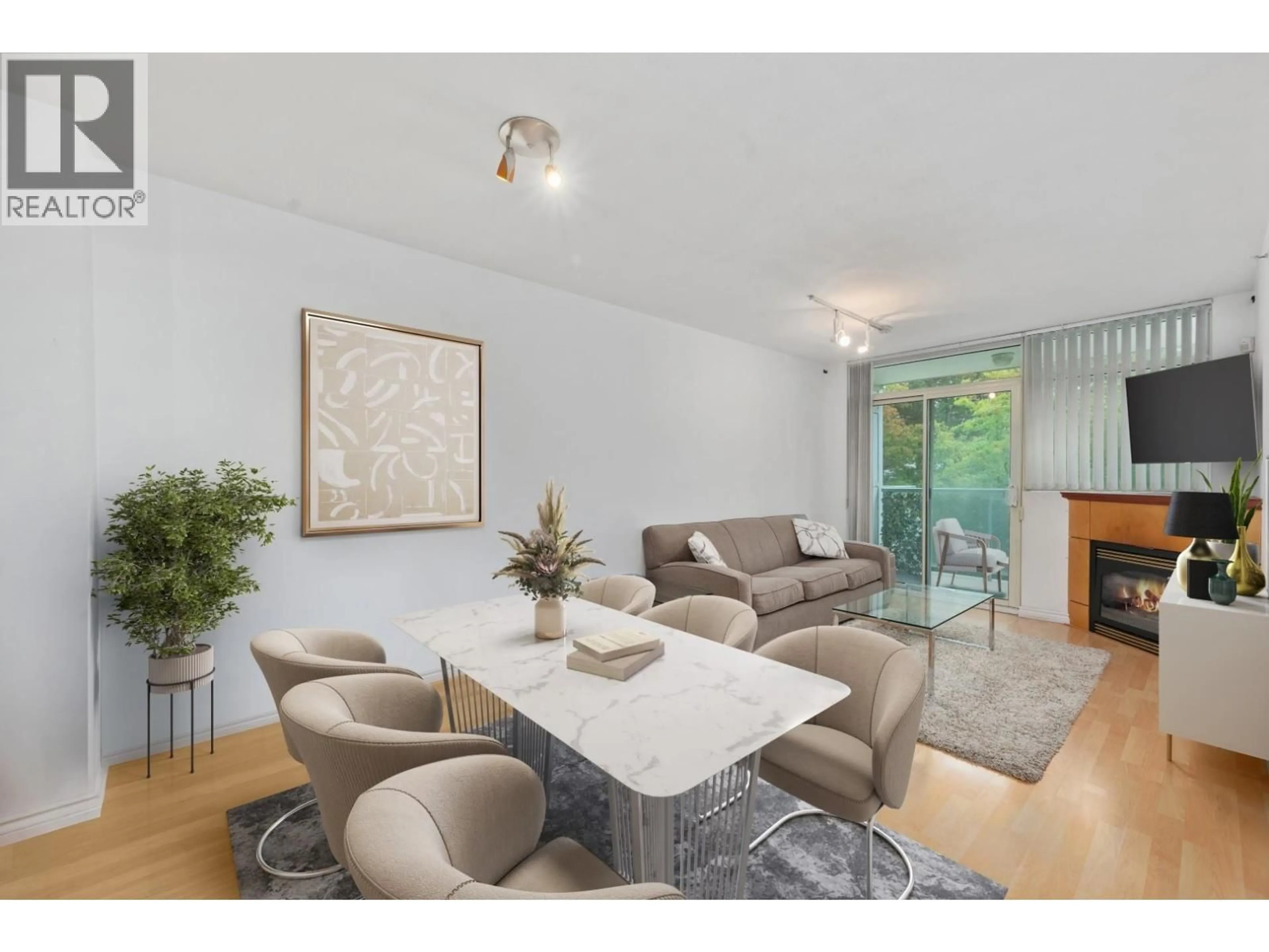 Living room with furniture, wood/laminate floor for 205 - 2733 CHANDLERY PLACE, Vancouver British Columbia V5S4V3