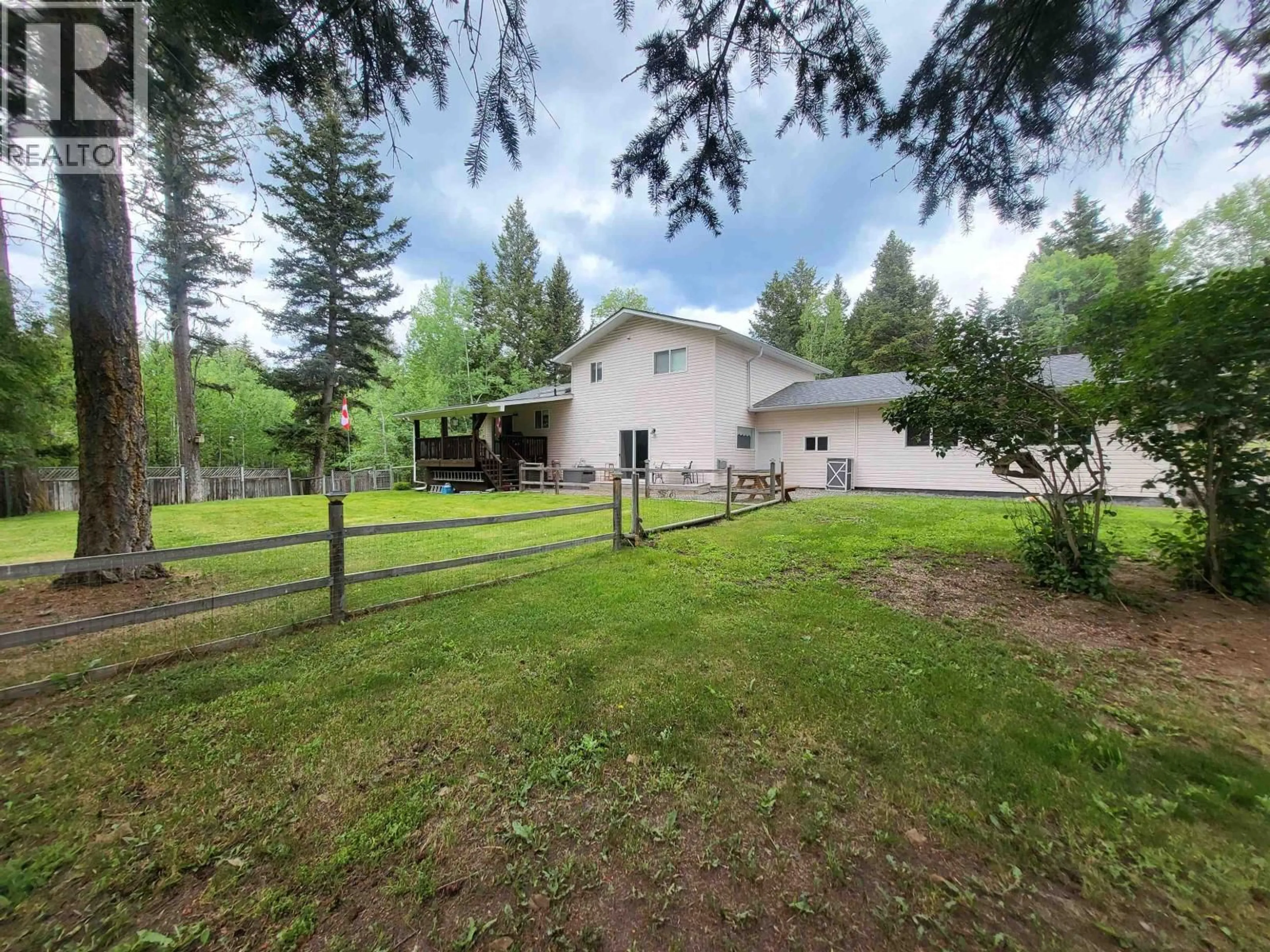 A pic from outside/outdoor area/front of a property/back of a property/a pic from drone, forest/trees view for 4887 MEESQUONO TRAIL, 108 Mile Ranch British Columbia V0K2Z0